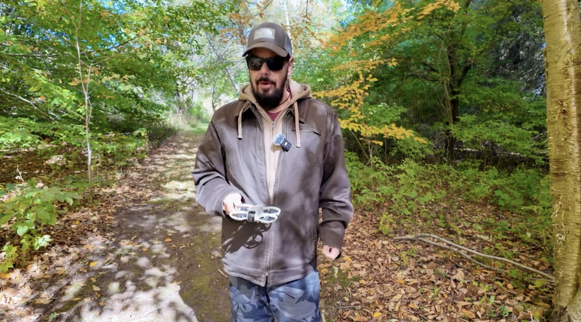 The DJI Neo launching from the palm of a hand without a controller.