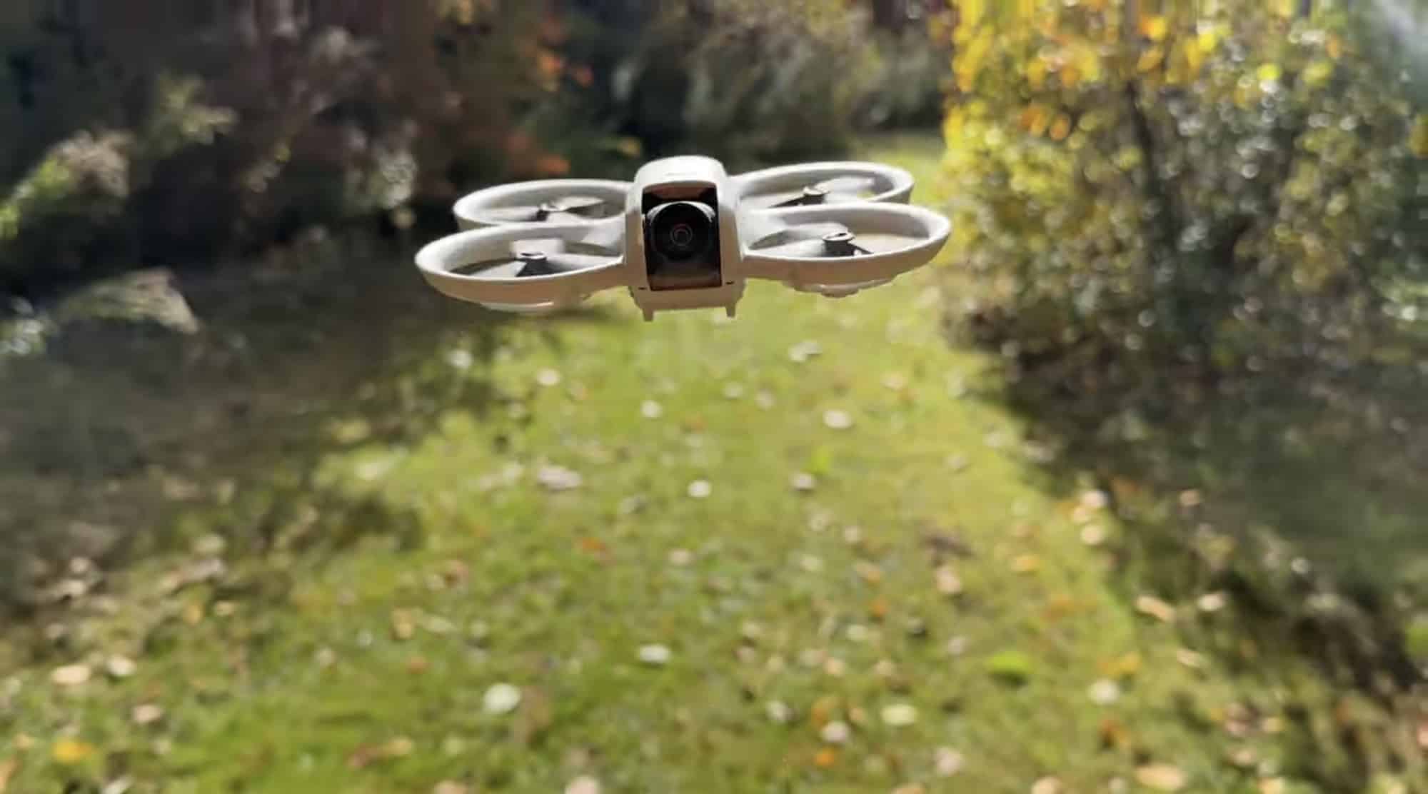 Frame from the review showing the Neo tracking through a stand of trees.