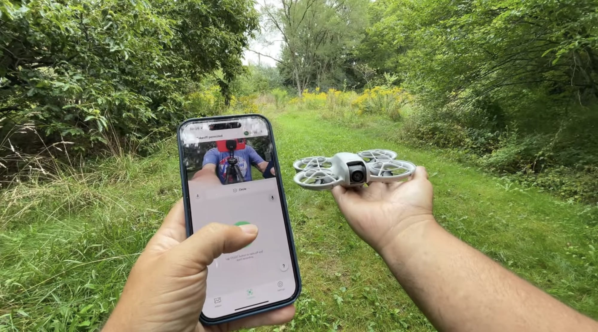 Flying the DJI Neo from an iPhone using the DJI Fly app.