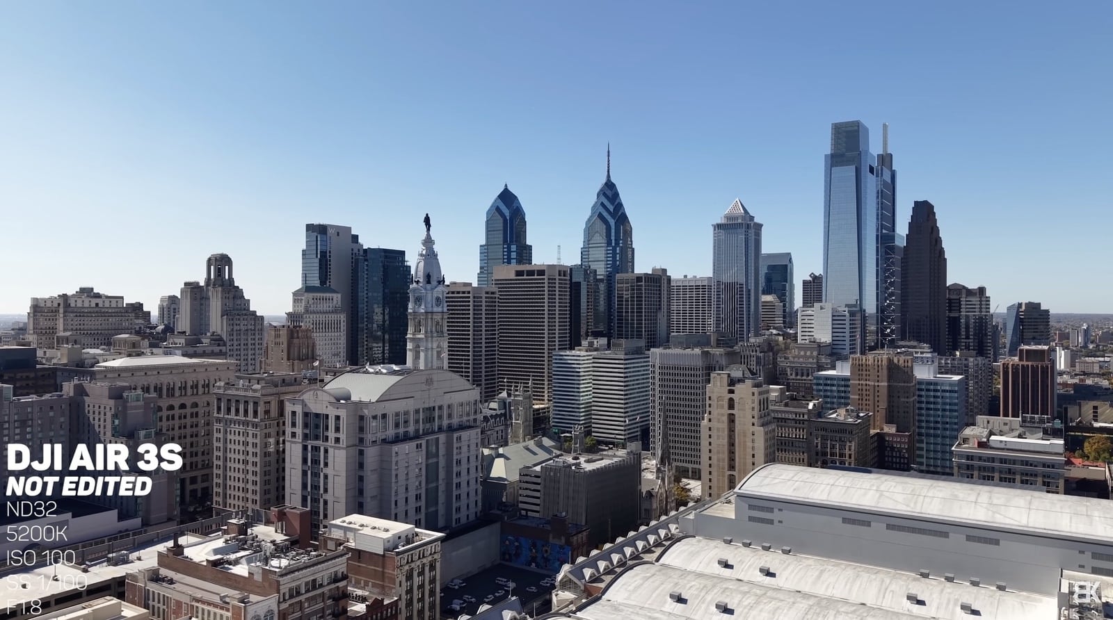 Ungraded Air 3S aerial of the Philadelphia skyline with exposure settings overlaid.