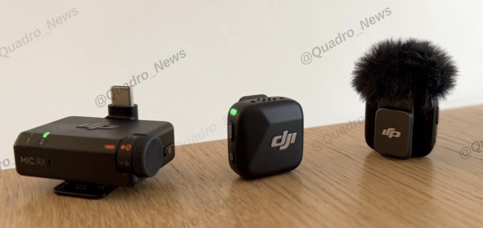 Open DJI Mic Mini charging case holding the transmitters and receiver.