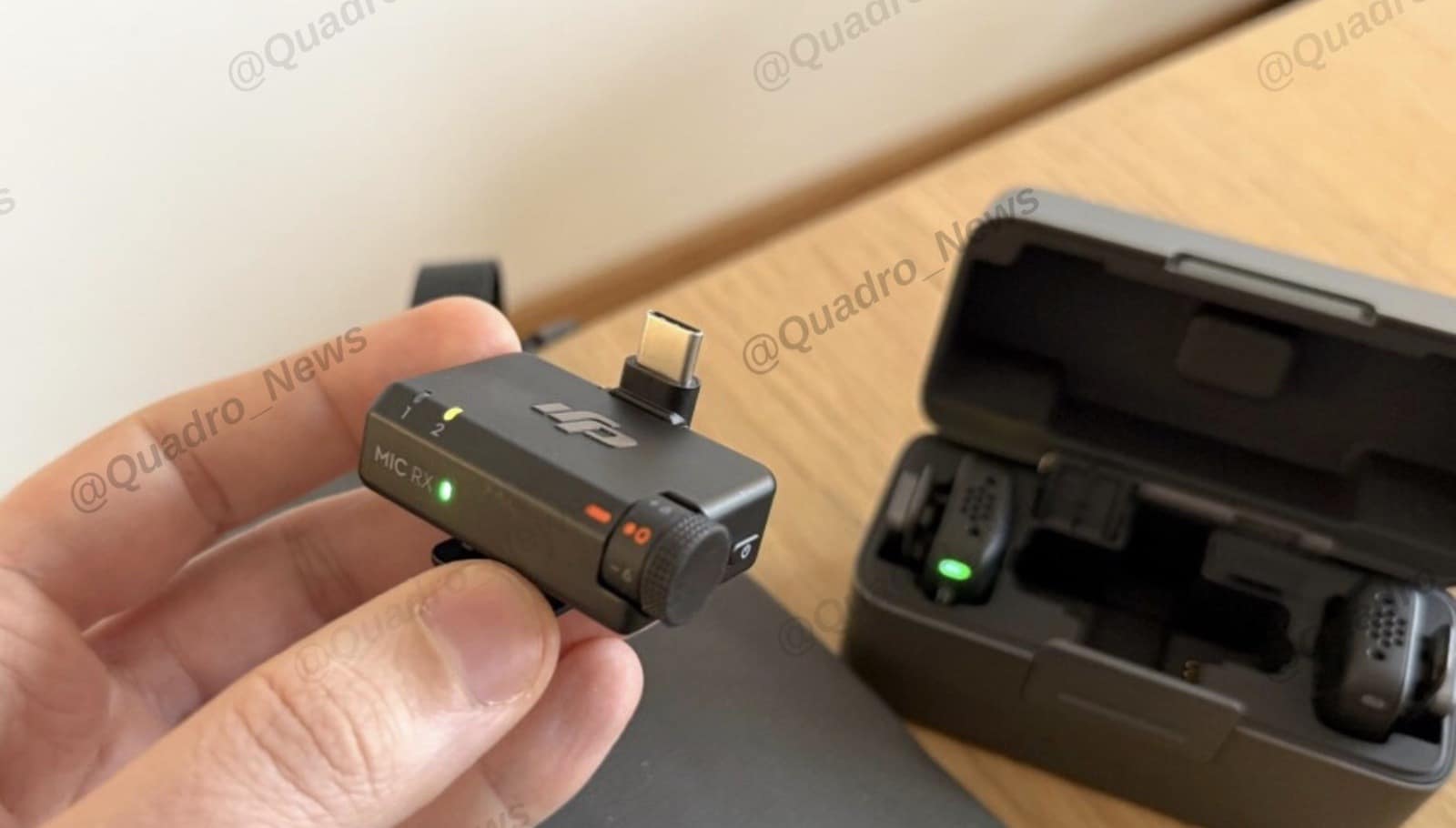 Second leaked video frame with the DJI Mic Mini connected to a smartphone.