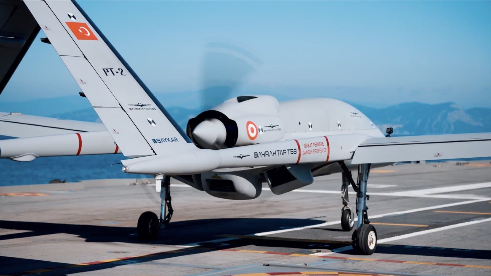 Close view of Bayraktar TB3 prototype PT-2 with its propeller turning on deck.