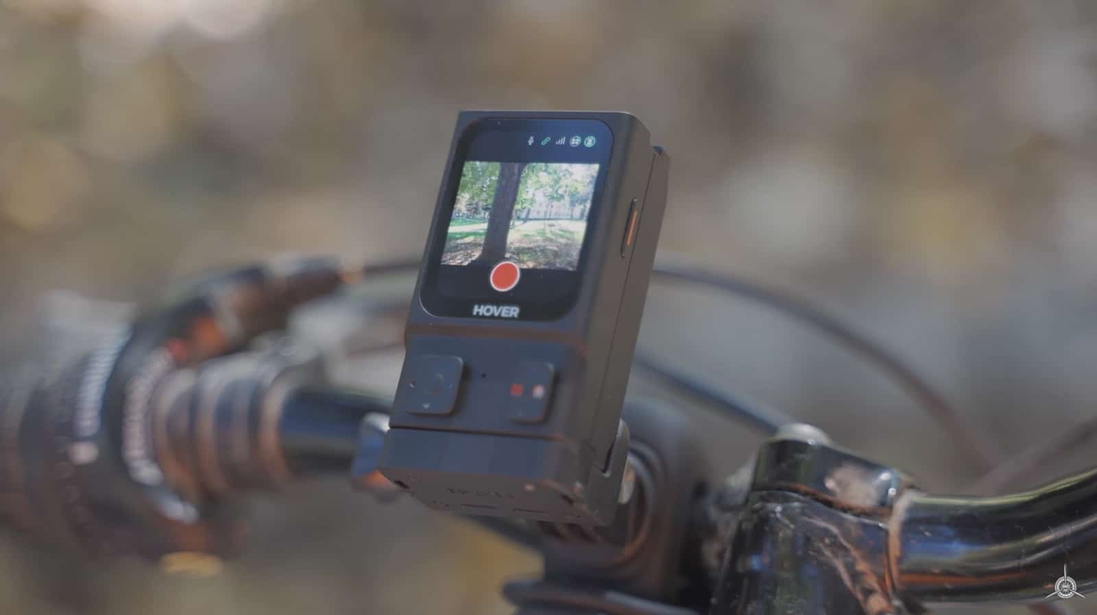 The Beacon clamped to mountain bike handlebars showing a live camera preview.