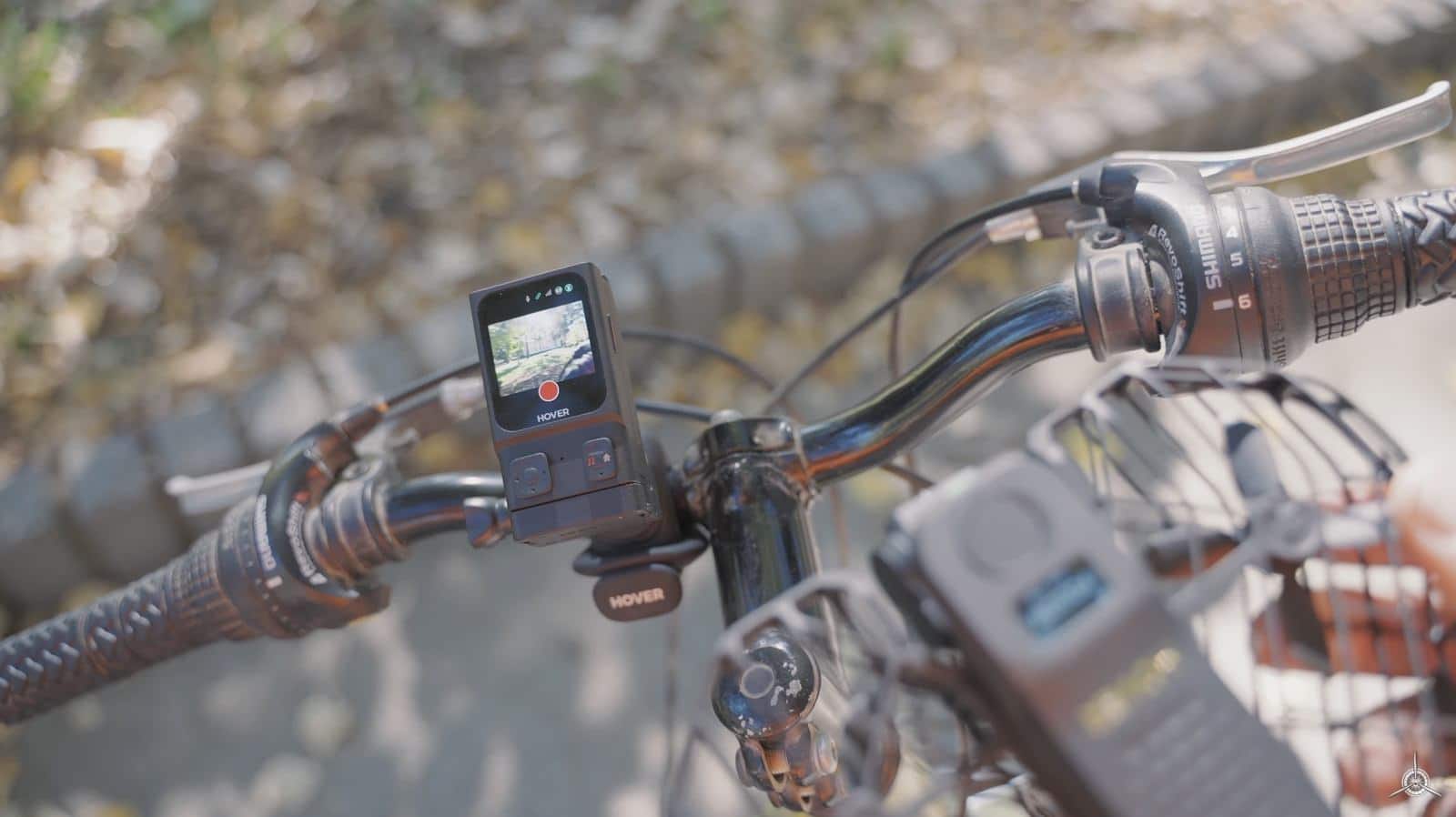 Wider view of the Beacon on the handlebars beside brake levers and shifters.