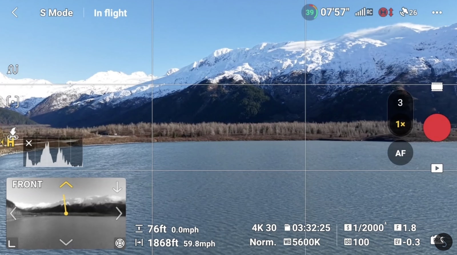 Screenshot of flight telemetry reading 59.8 mph in Sport mode over a mountain lake.