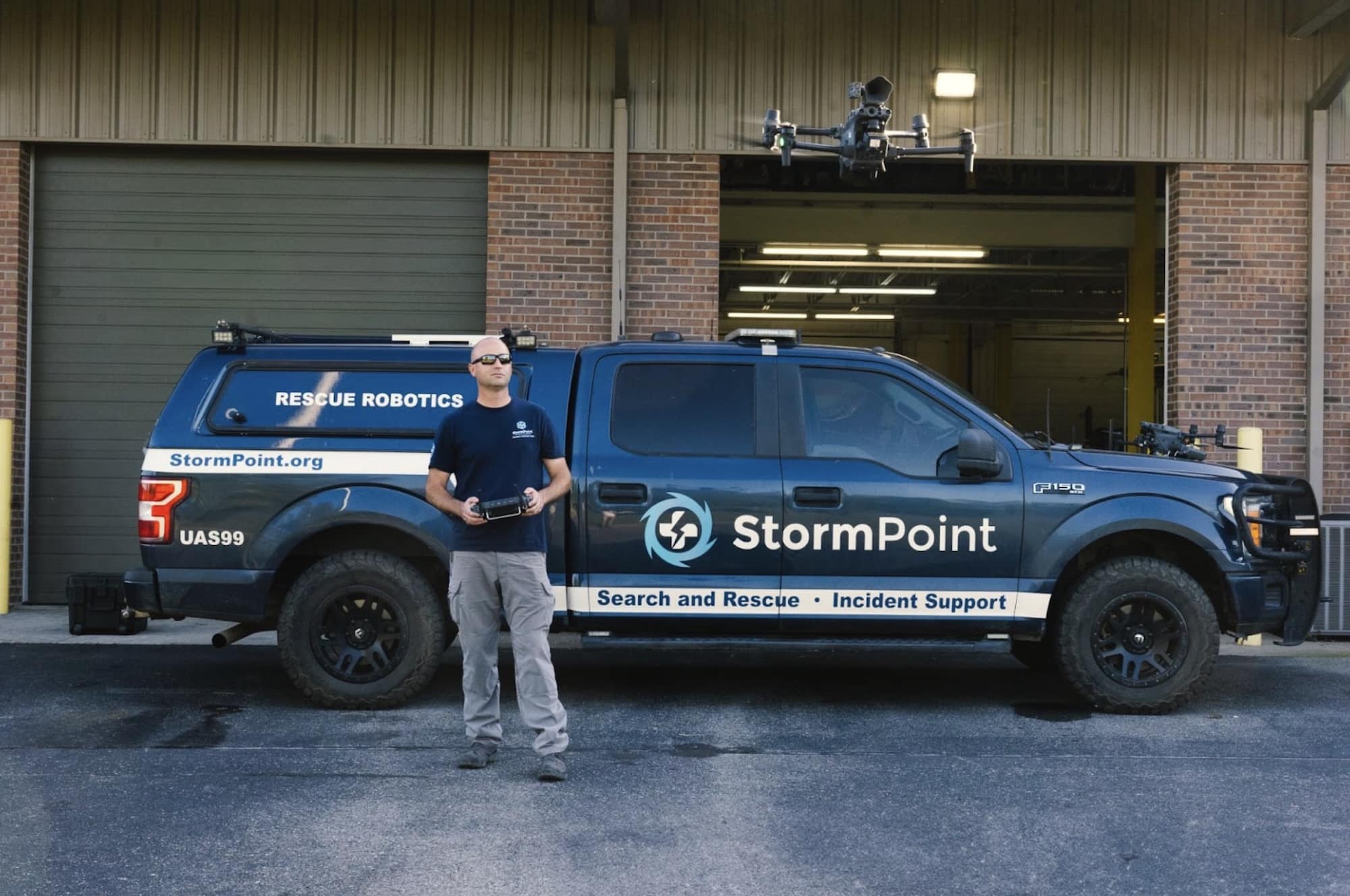 StormPoint search and rescue truck as an operator flies a drone from the bay.