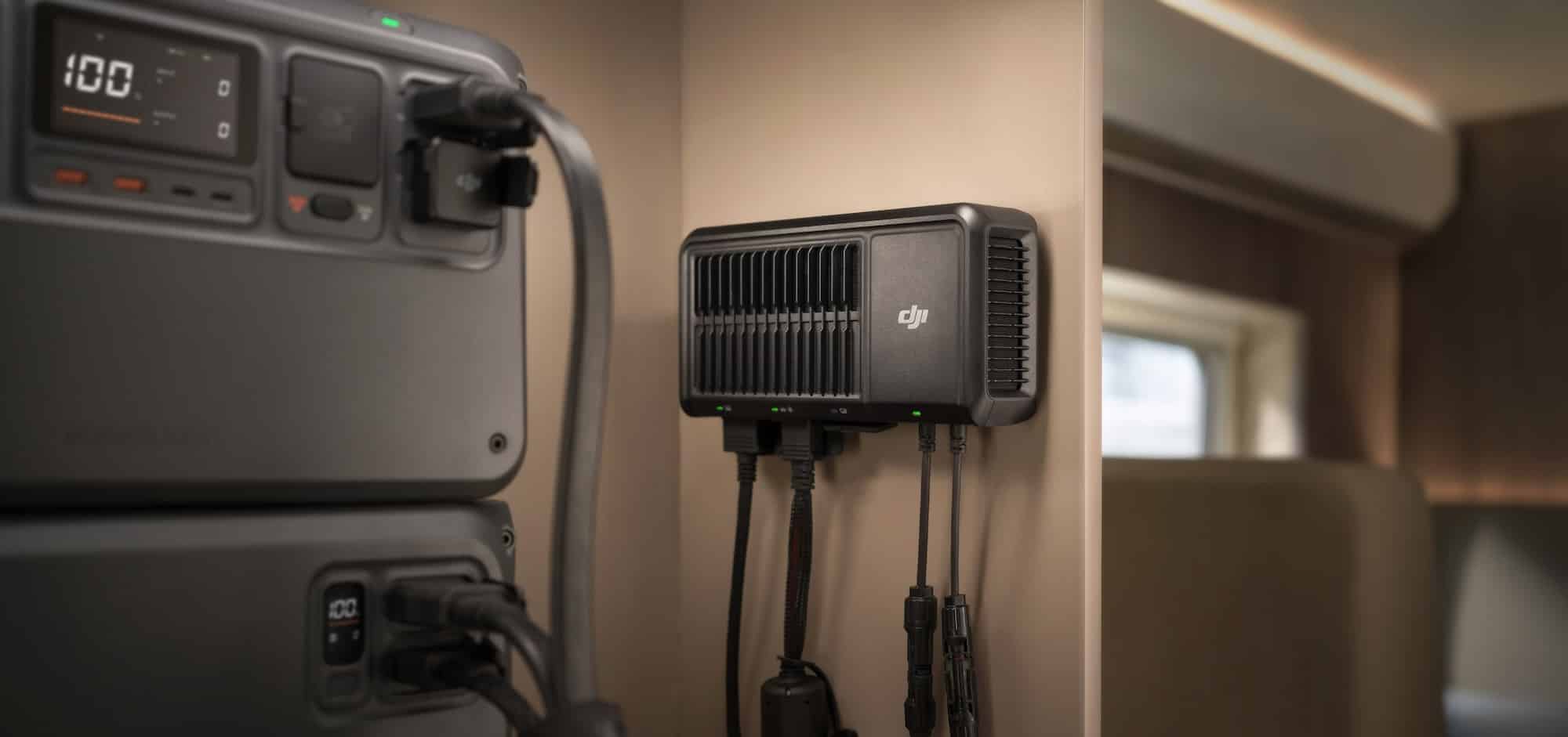 DJI fast charger mounted on an interior wall beside a portable power station.