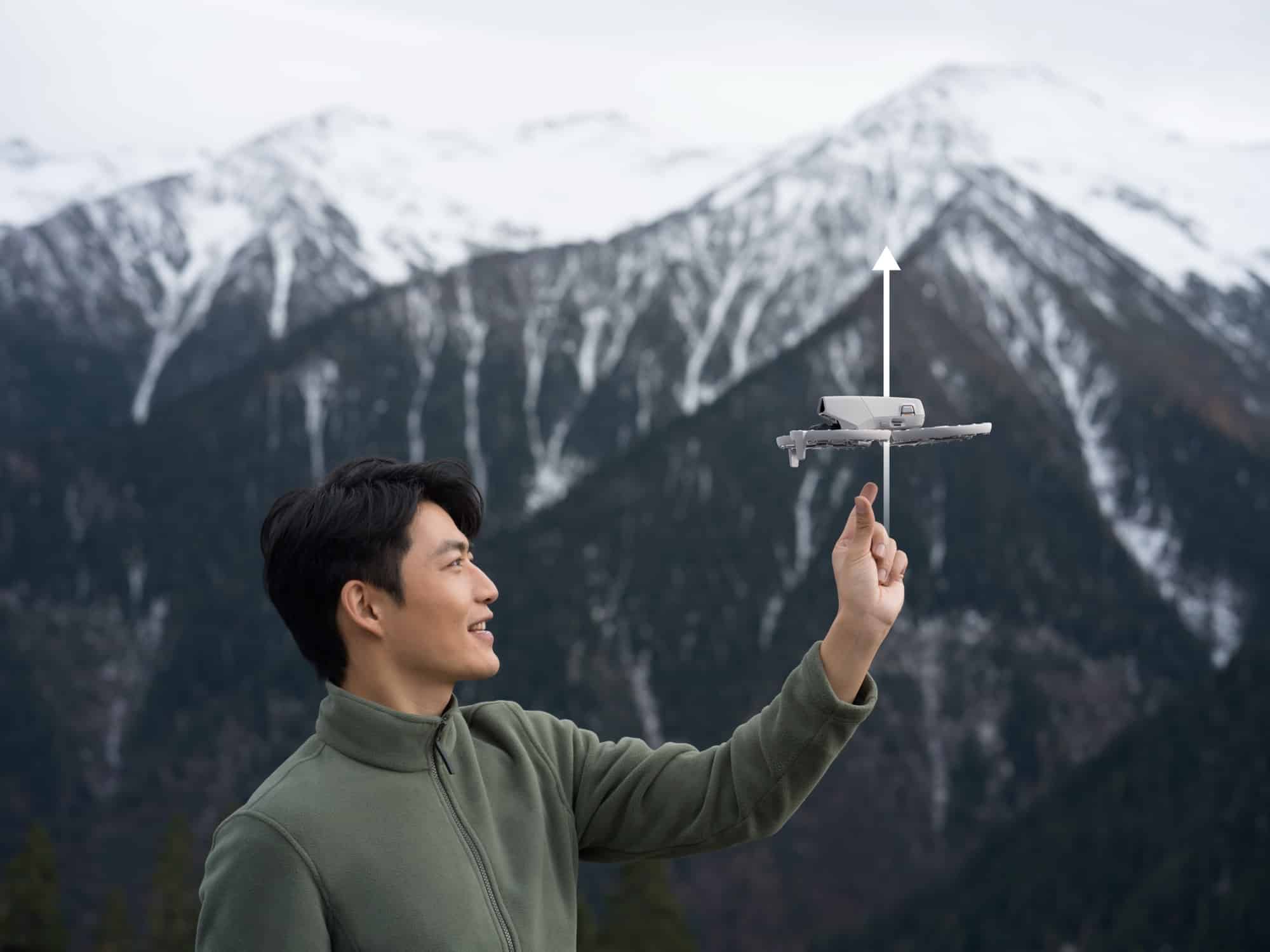 Man releasing the Flip from his palm as an arrow marks its vertical climb.