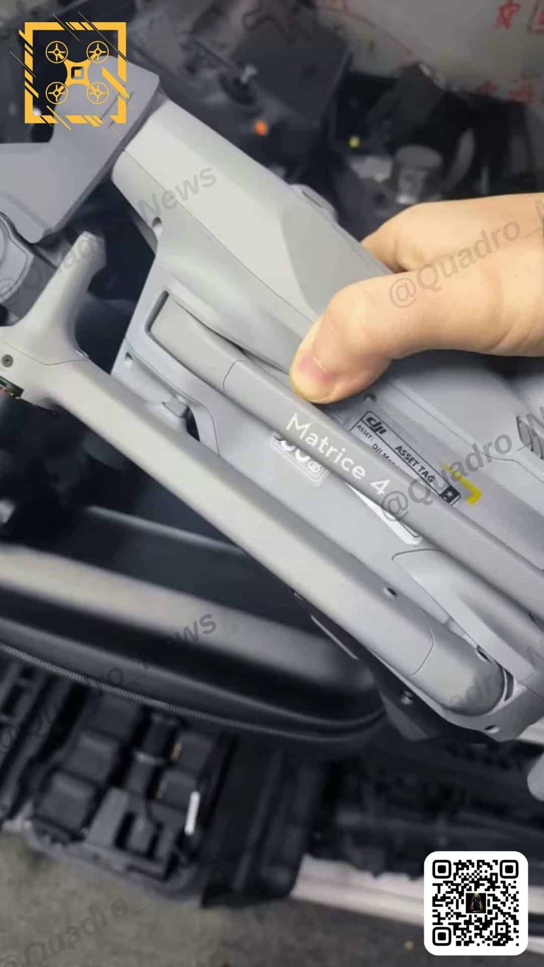 Leaked photo of a hand lifting a Matrice 4 demo unit from its case.