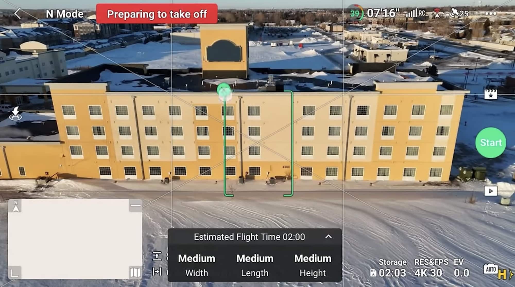 Screenshot of an automated shot being framed above a yellow hotel building.