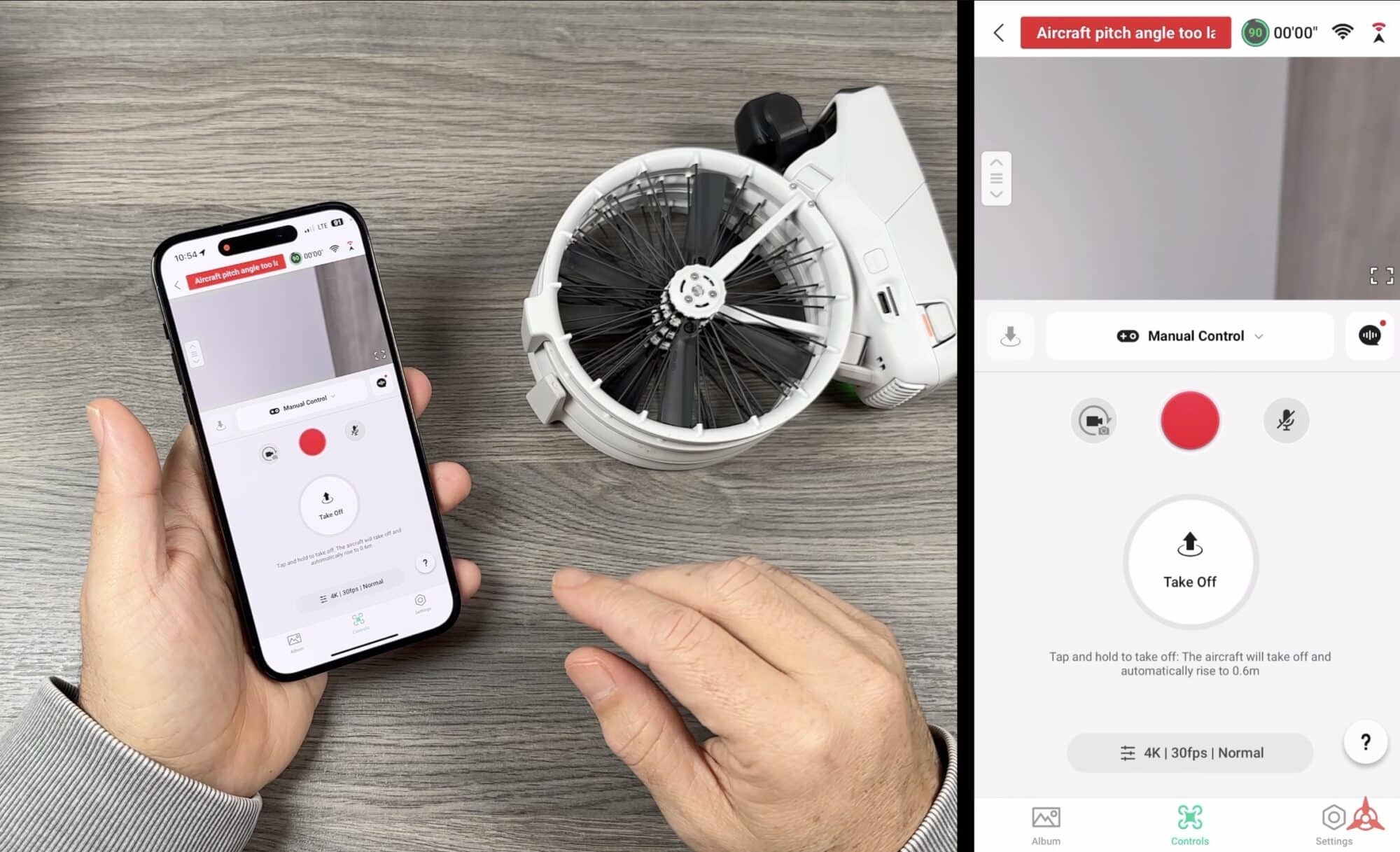 Hand holding a phone beside a folded DJI Flip and the app takeoff screen.