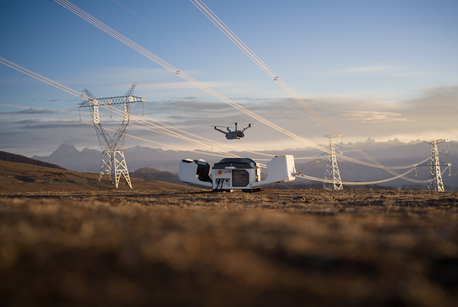Dock lid open on the plain as the drone lifts off between two towers.