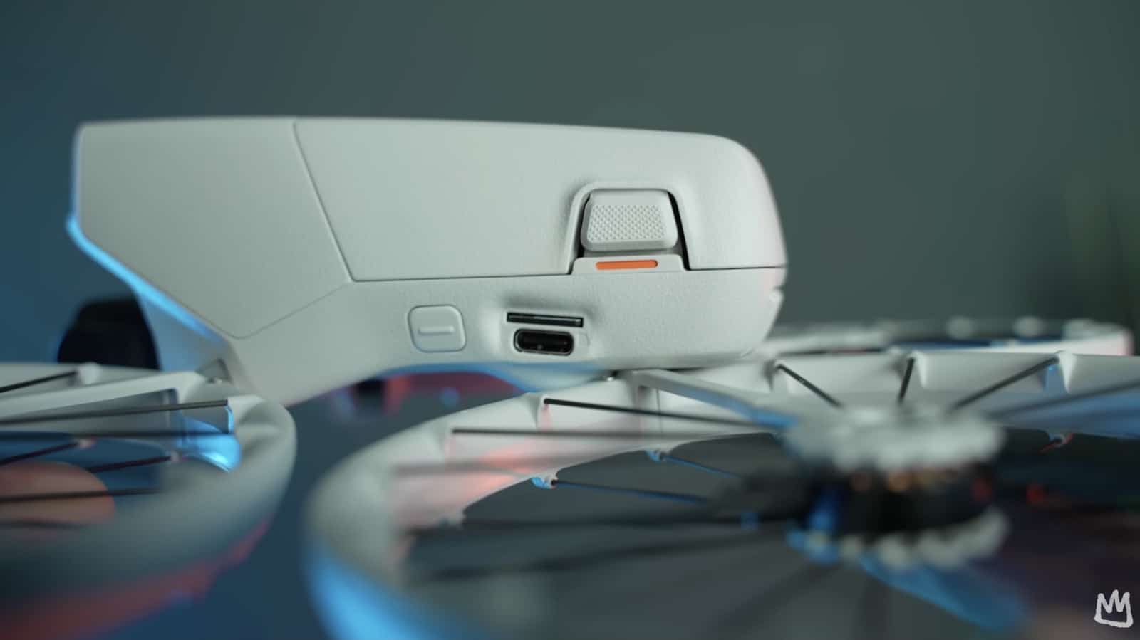 Macro view of the DJI Flip body with a single amber status light.