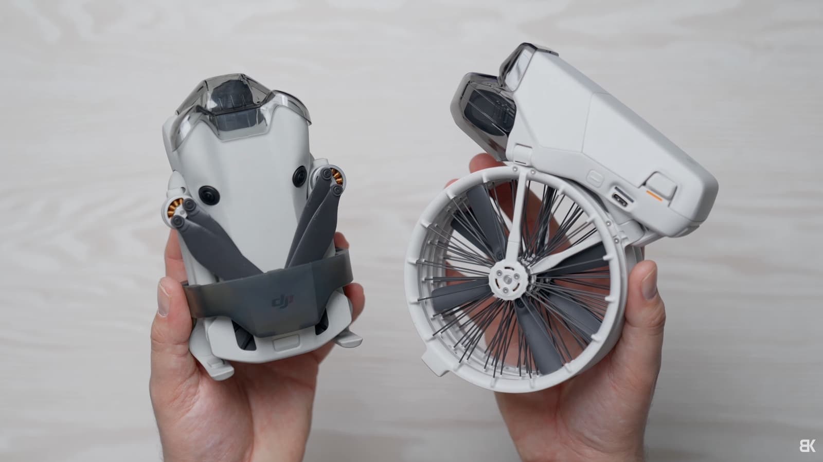 DJI Mini 4 Pro on the left beside the caged DJI Flip on the right.