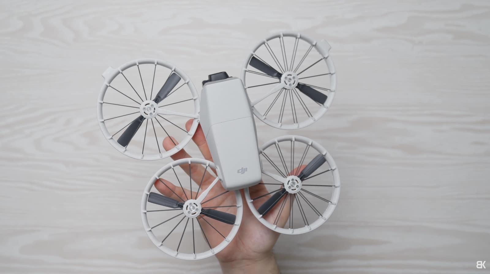 DJI Flip folded for travel with the propeller cages tucked against the body.