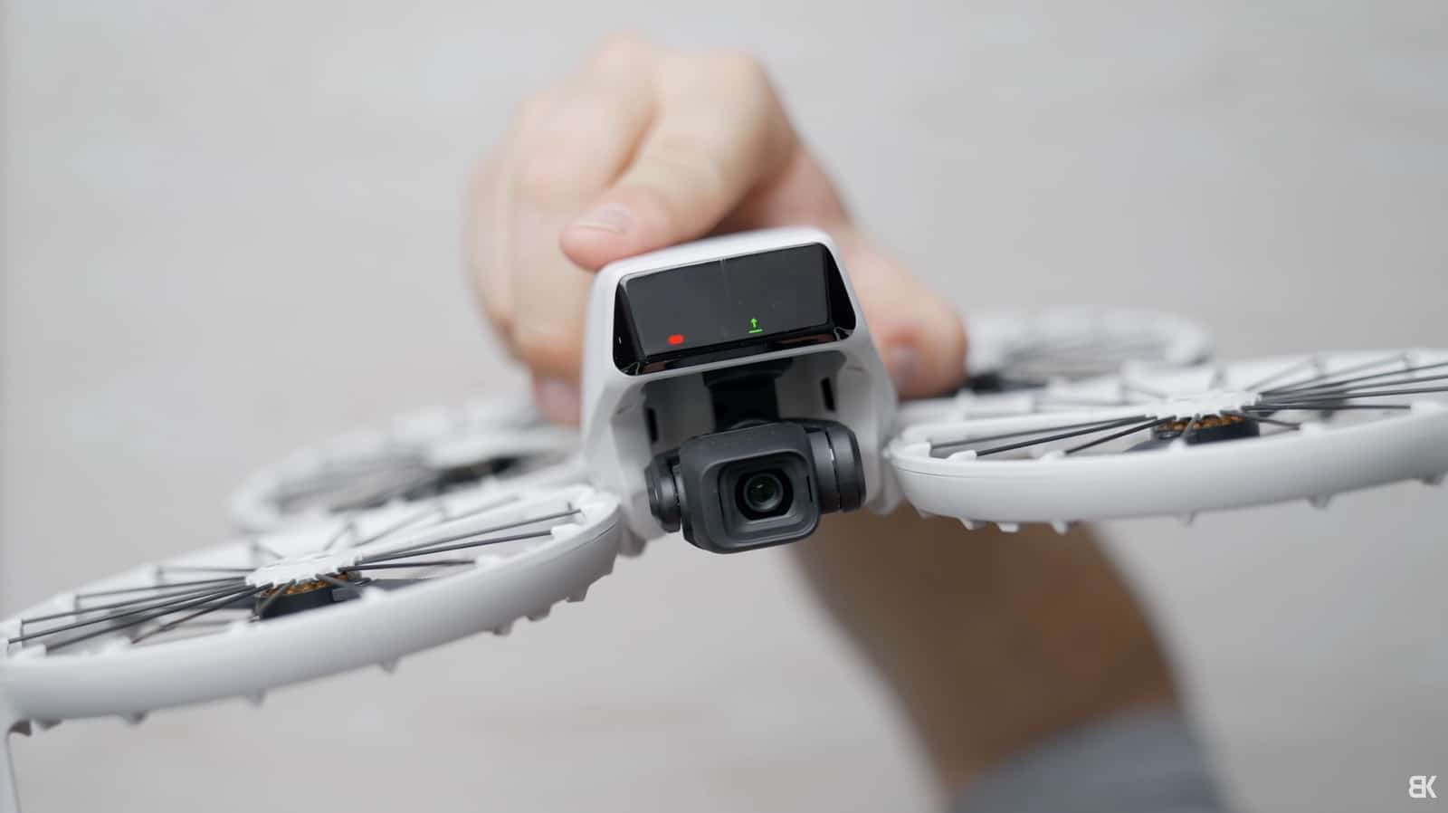 Side button and front screen the DJI Flip uses to pick automated flight modes.