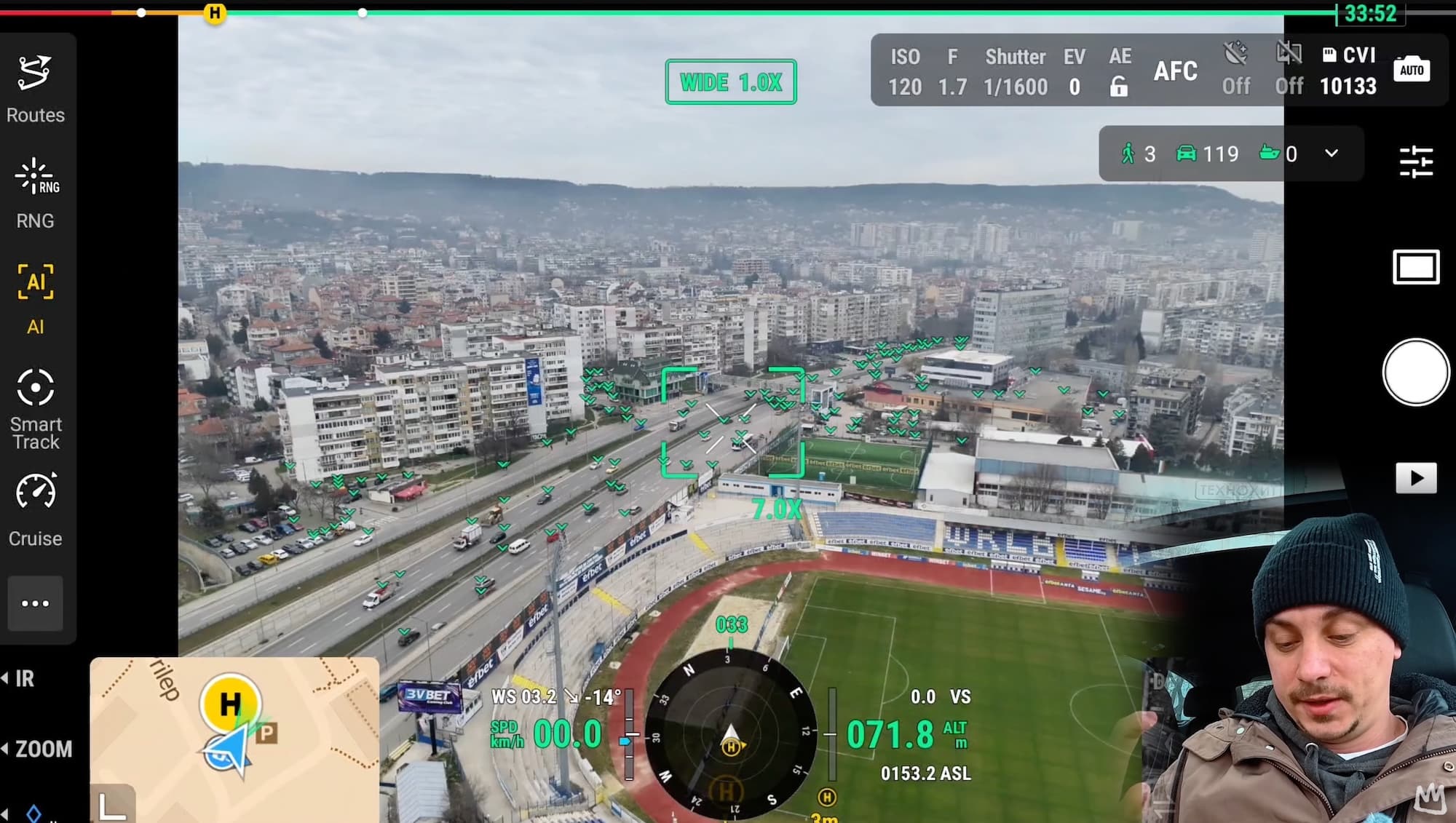 Enterprise flight app view with AI detection boxes over a city stadium.