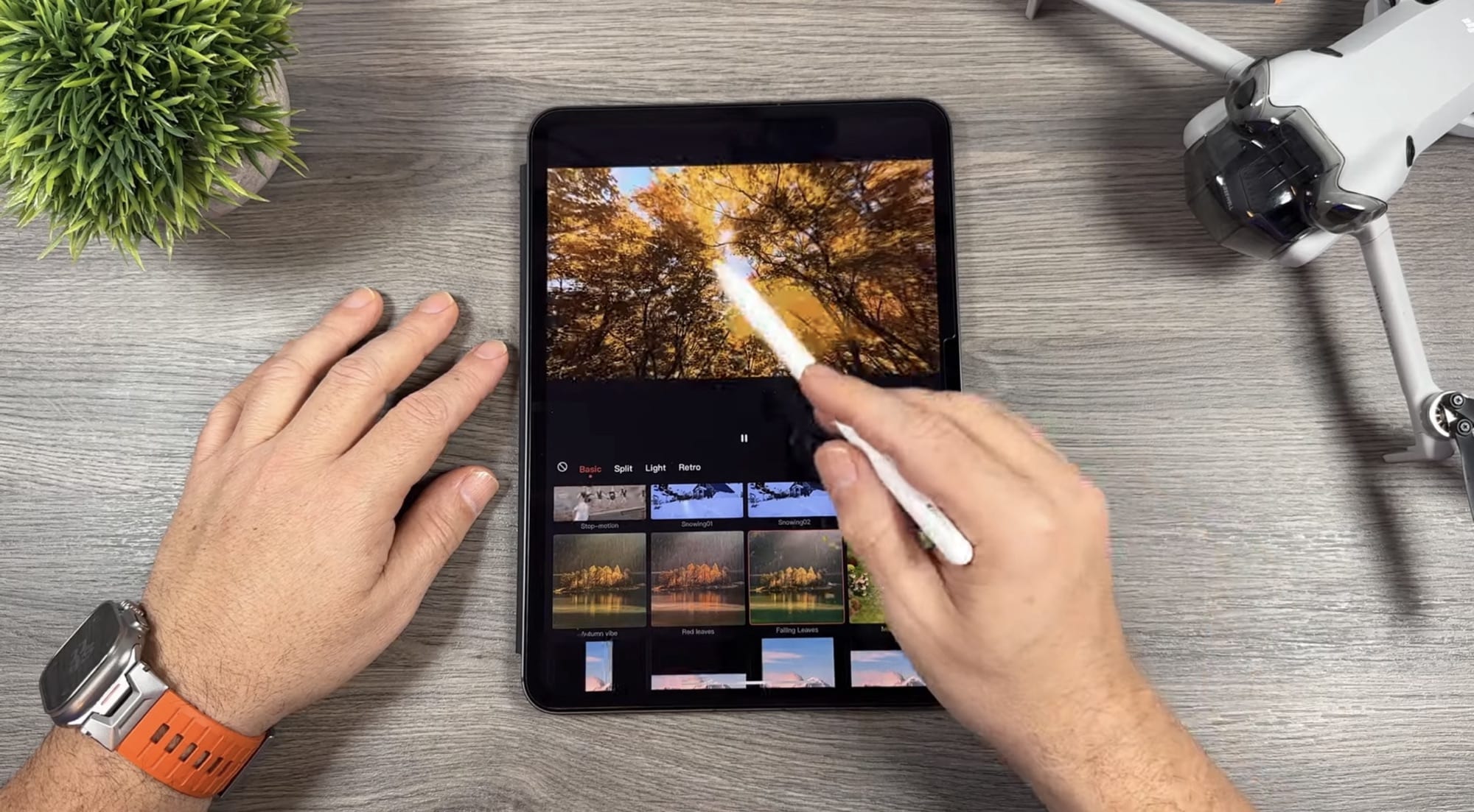 Stylus applies an effect to an autumn clip in the tablet editor.