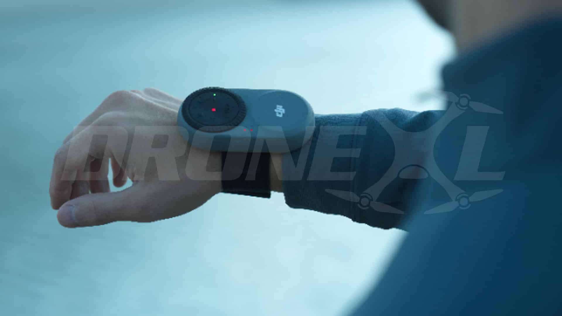 Close-up of the wrist-worn beacon strapped over a blue sleeve.