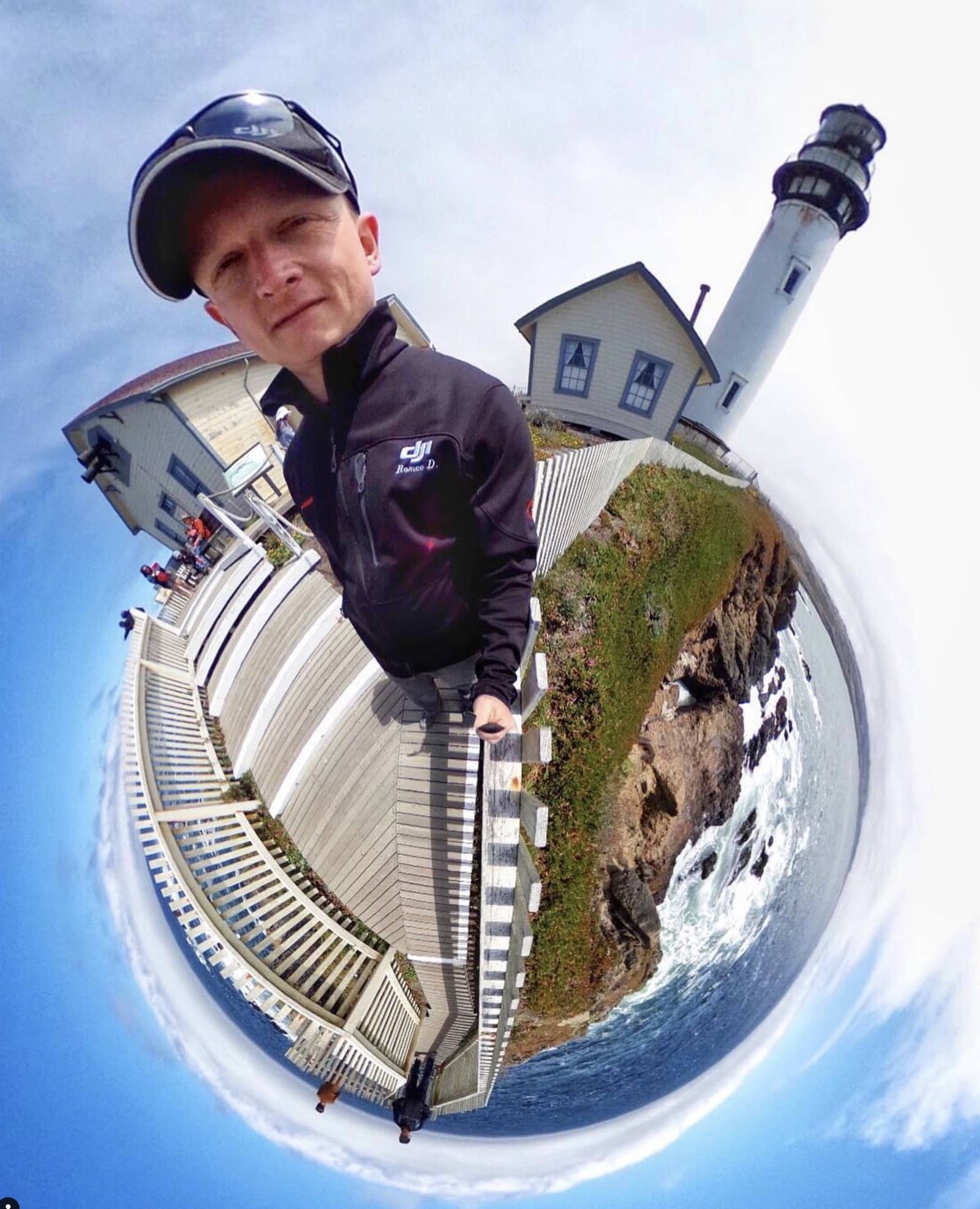 A tiny-planet 360 image wraps a lighthouse coastline around the photographer's face.