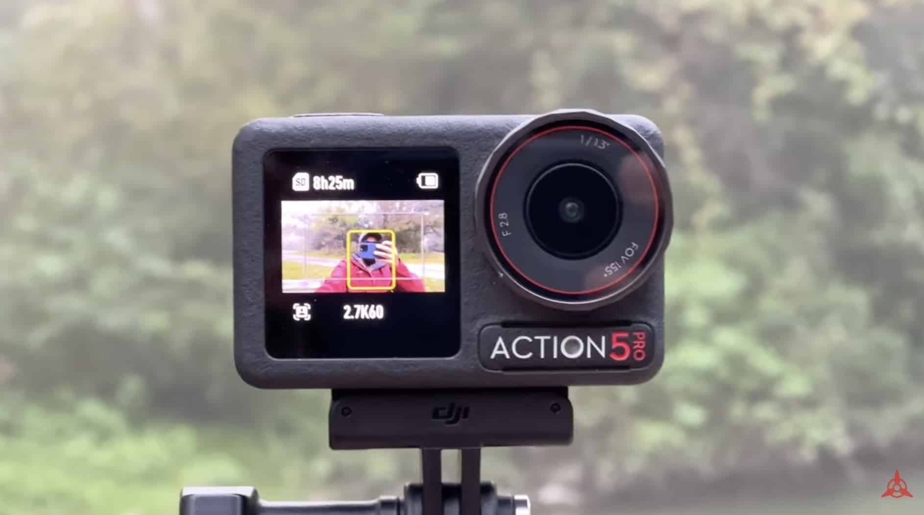 The DJI Action 5 Pro held at arm's length while subject tracking keeps the vlogger centered.