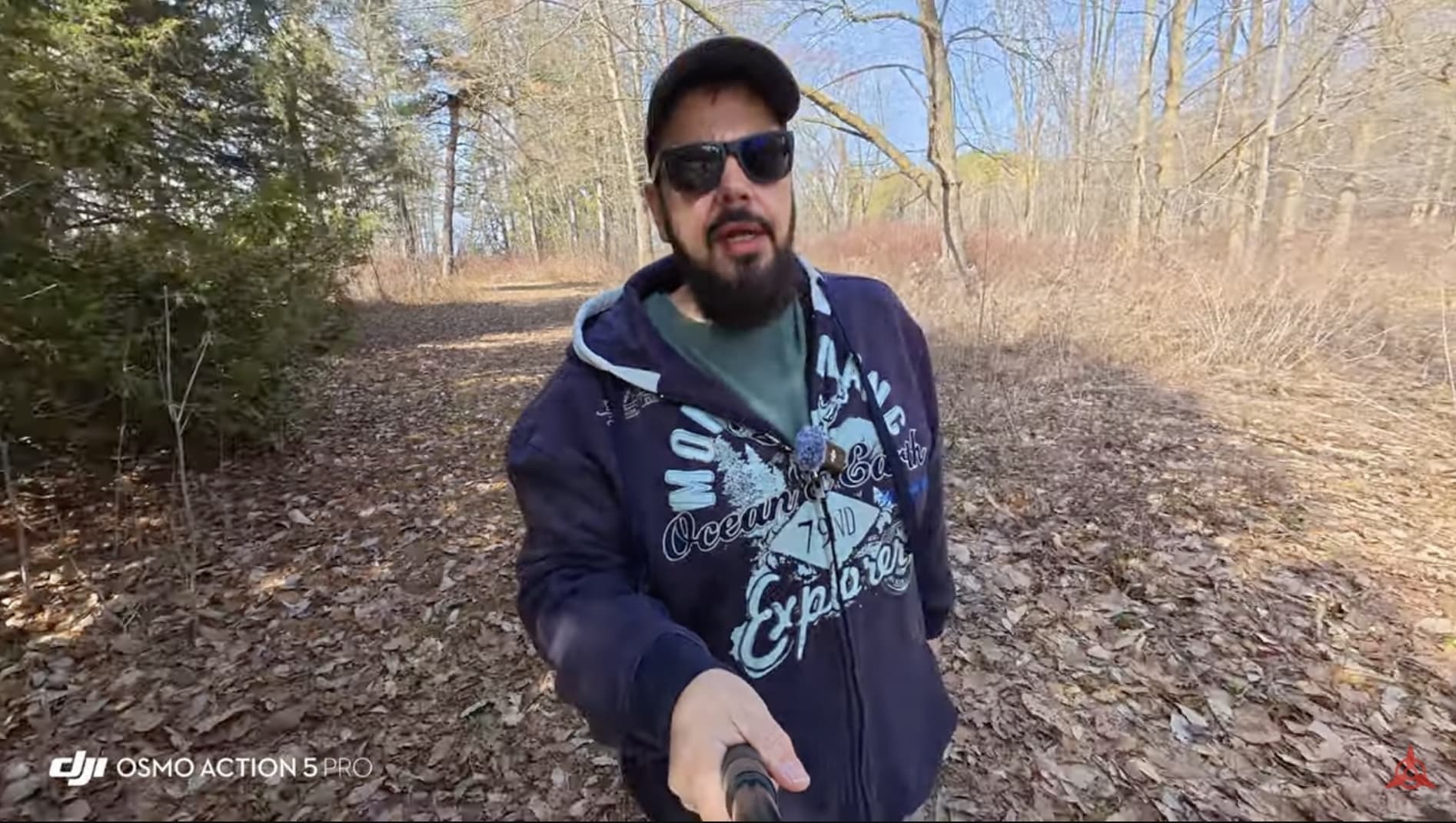 The DJI Action 5 Pro and DJI Pocket 3 compared as handheld vlogging cameras outdoors.