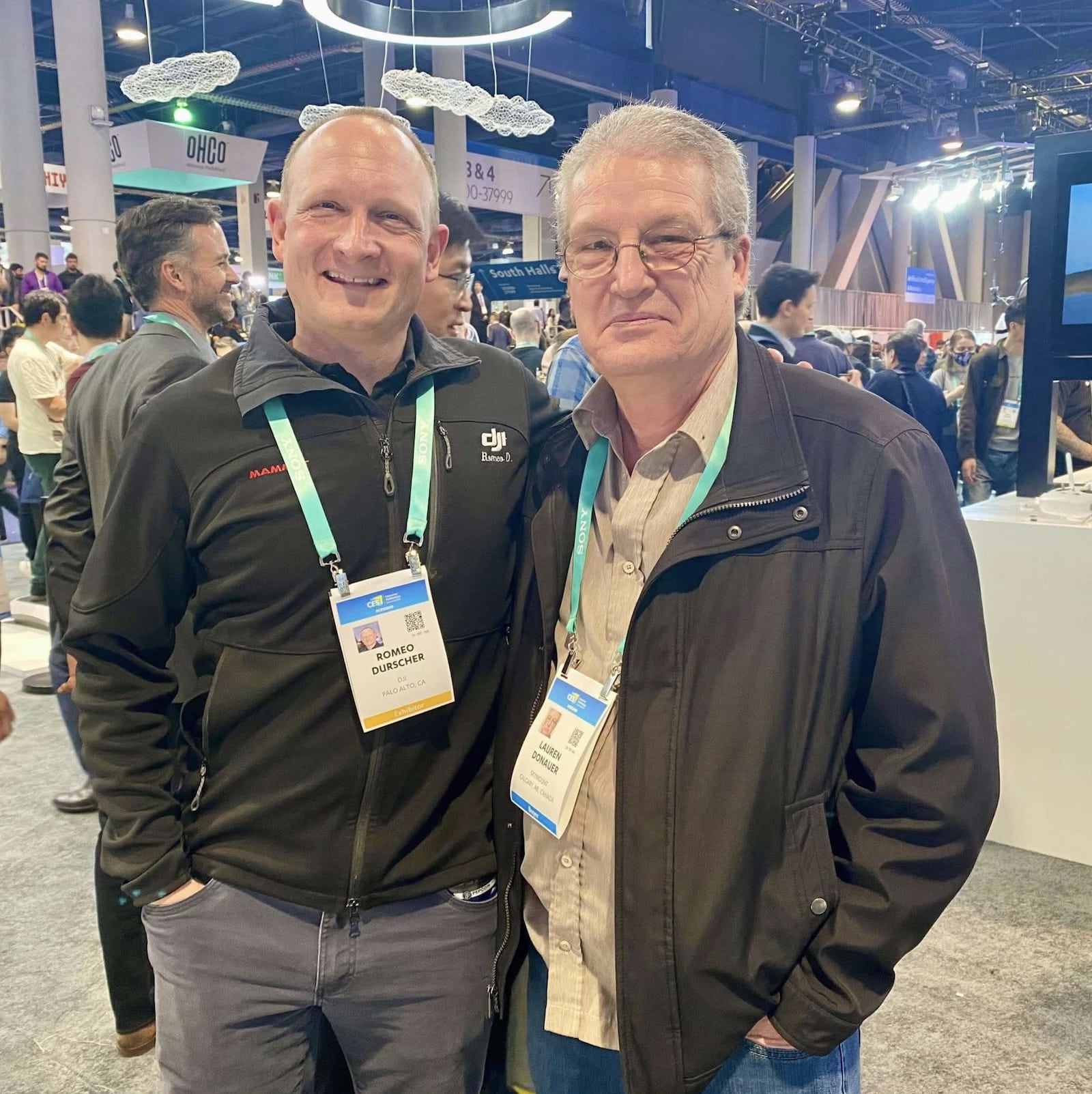 Romeo Durscher poses with a fellow badge-wearing attendee on the CES 2020 show floor.