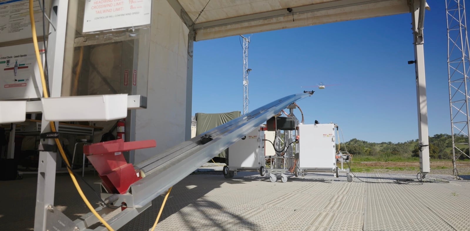Wide view of the angled launch ramp aimed out through the building doors.
