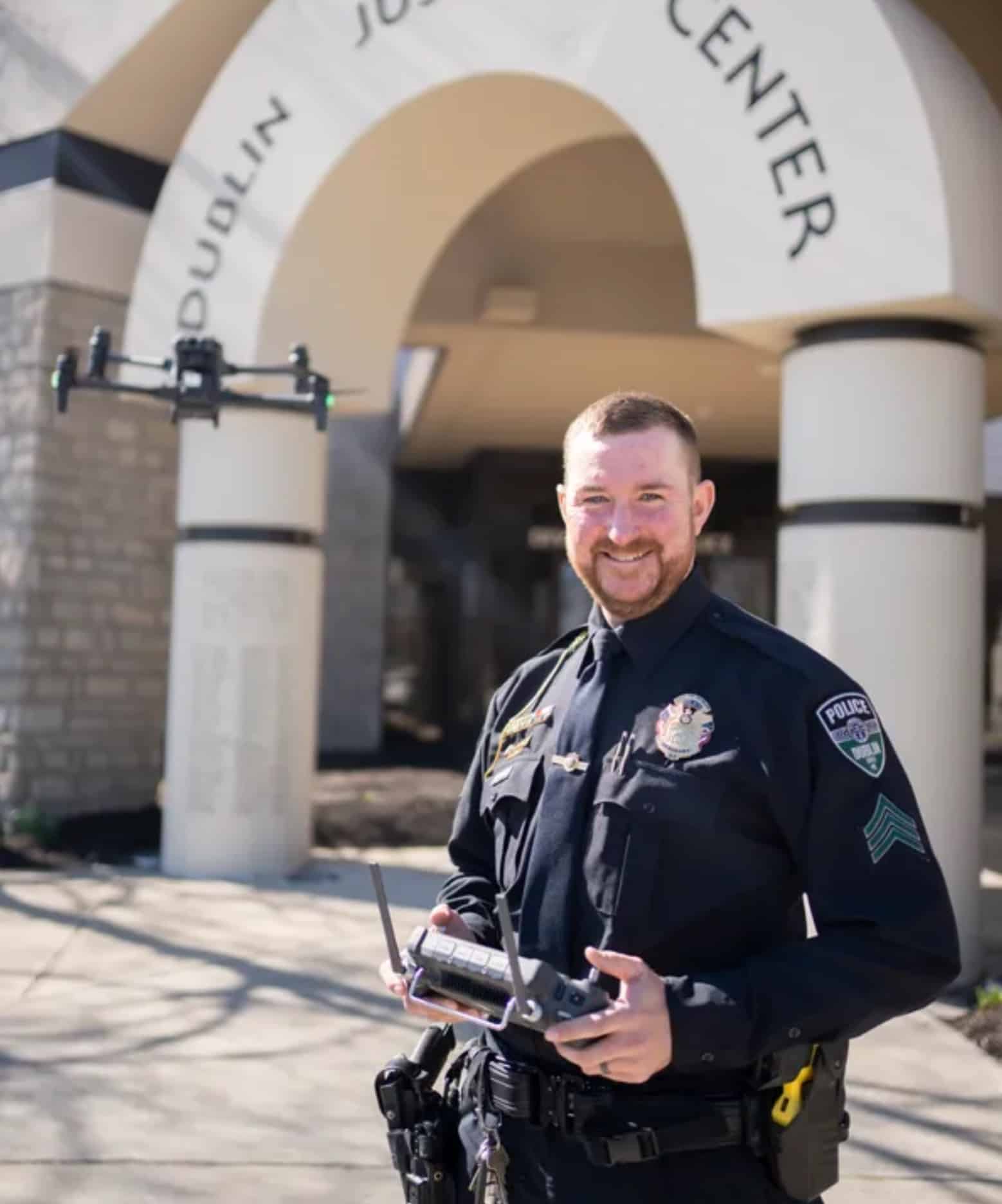 Dublin police Sgt. Andrew Clark showcased the department’s drones on March 26, 2025, outside the Dublin Justice Center. The city is launching the largest Drone as First Responders program in central Ohio, aiming to respond to emergencies in 90 seconds. Photo courtesy of Courtney Hergesheimer / Columbus Dispatch