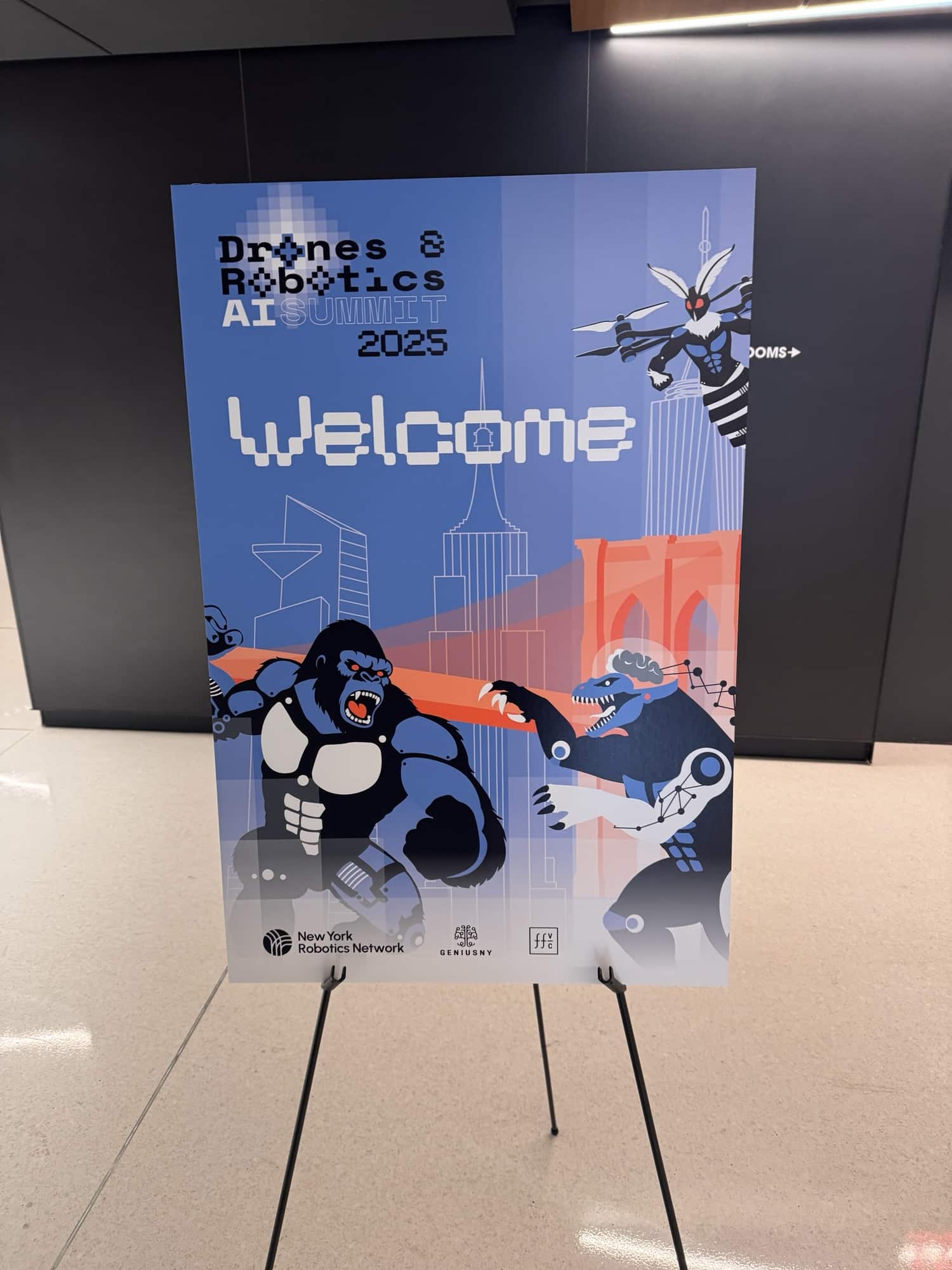 A Welcome easel sign for the Drones, Robotics and AI Summit 2025.