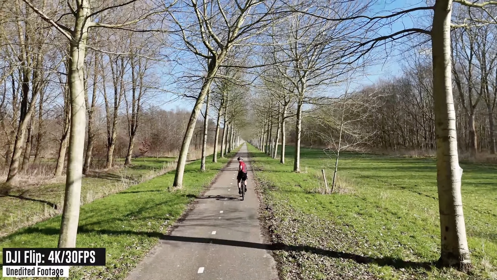 The DJI Flip following from behind through the tree tunnel section of the Gauntlet course.