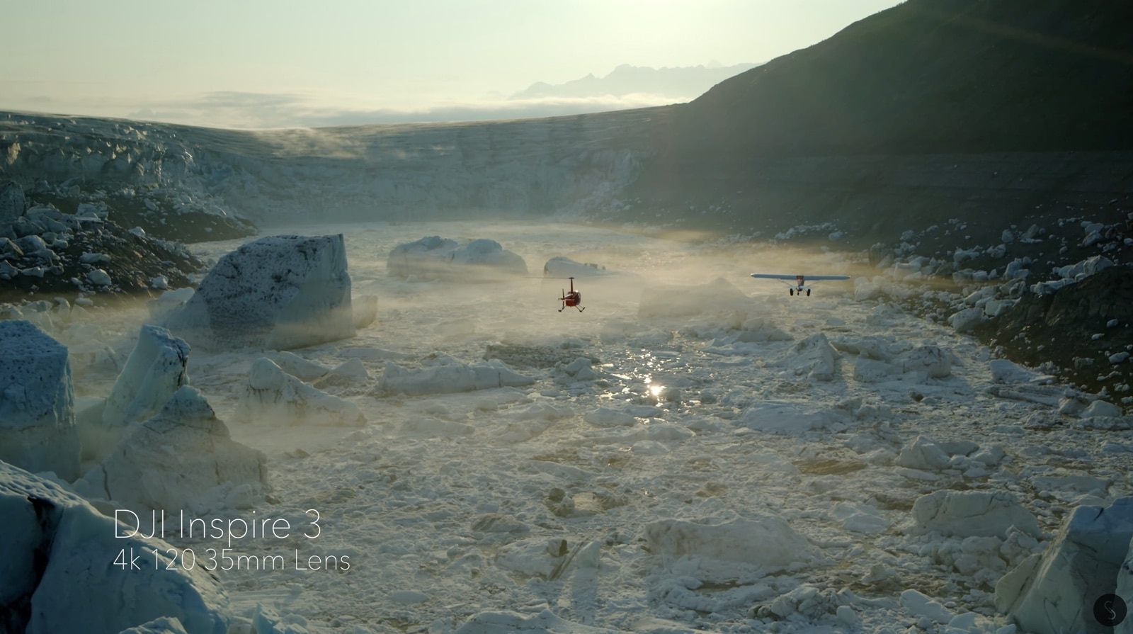 Aerial frame labelled 4K 120 with the 35mm lens over a broken ice shelf.