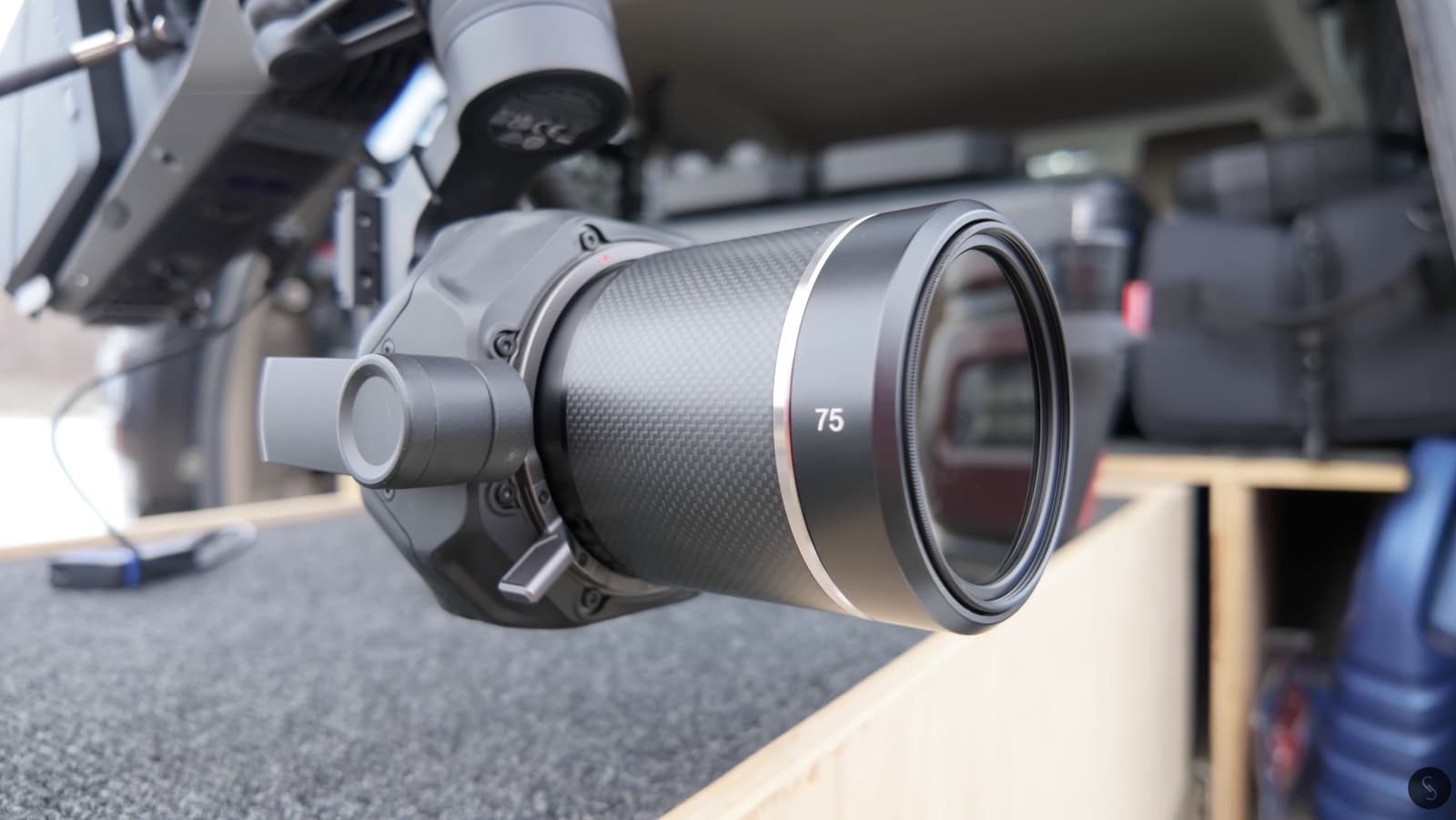 Close-up of a 75mm prime lens mounted on the cinema drone's gimbal.