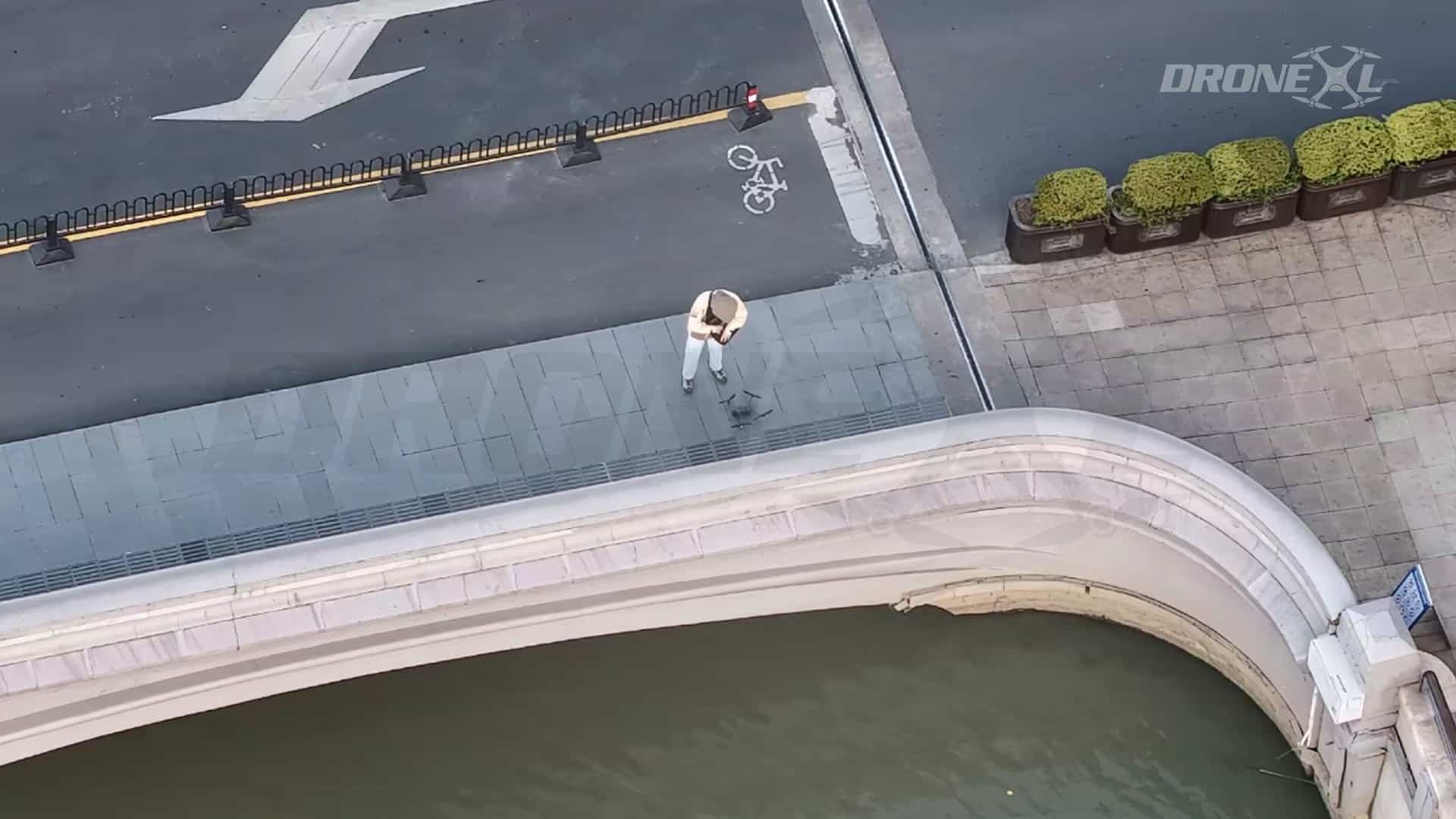 Man setting up his DJI Mavic 4 Pro in public.