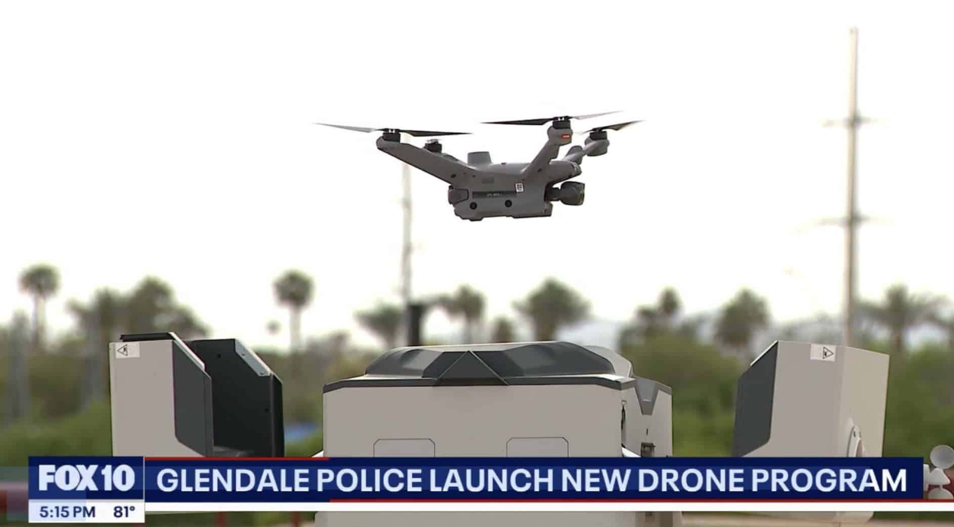 News still of the drone airborne above its dock with palm trees beyond.