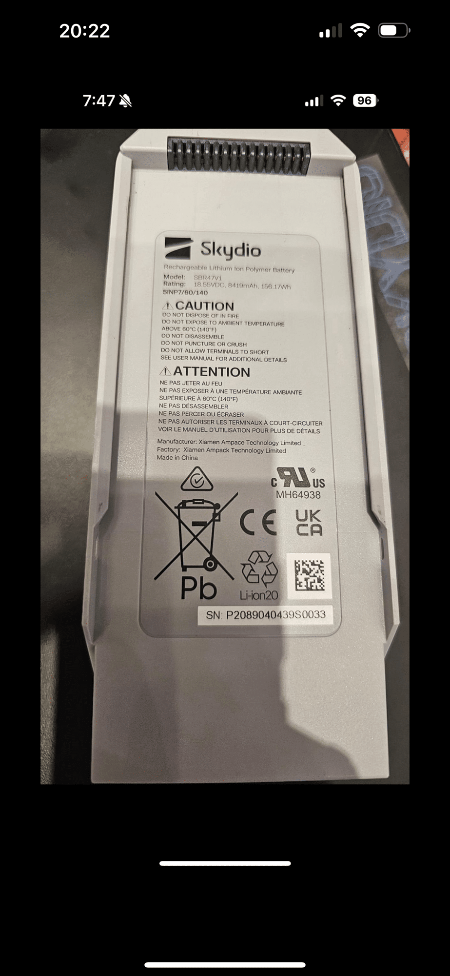 Phone photo of a Skydio battery label showing it was manufactured in China.