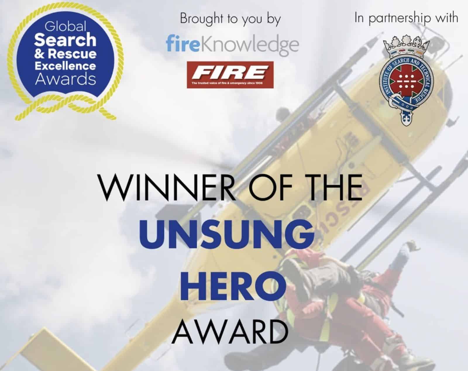 Award graphic reading winner of the Unsung Hero Award over a rescue helicopter.