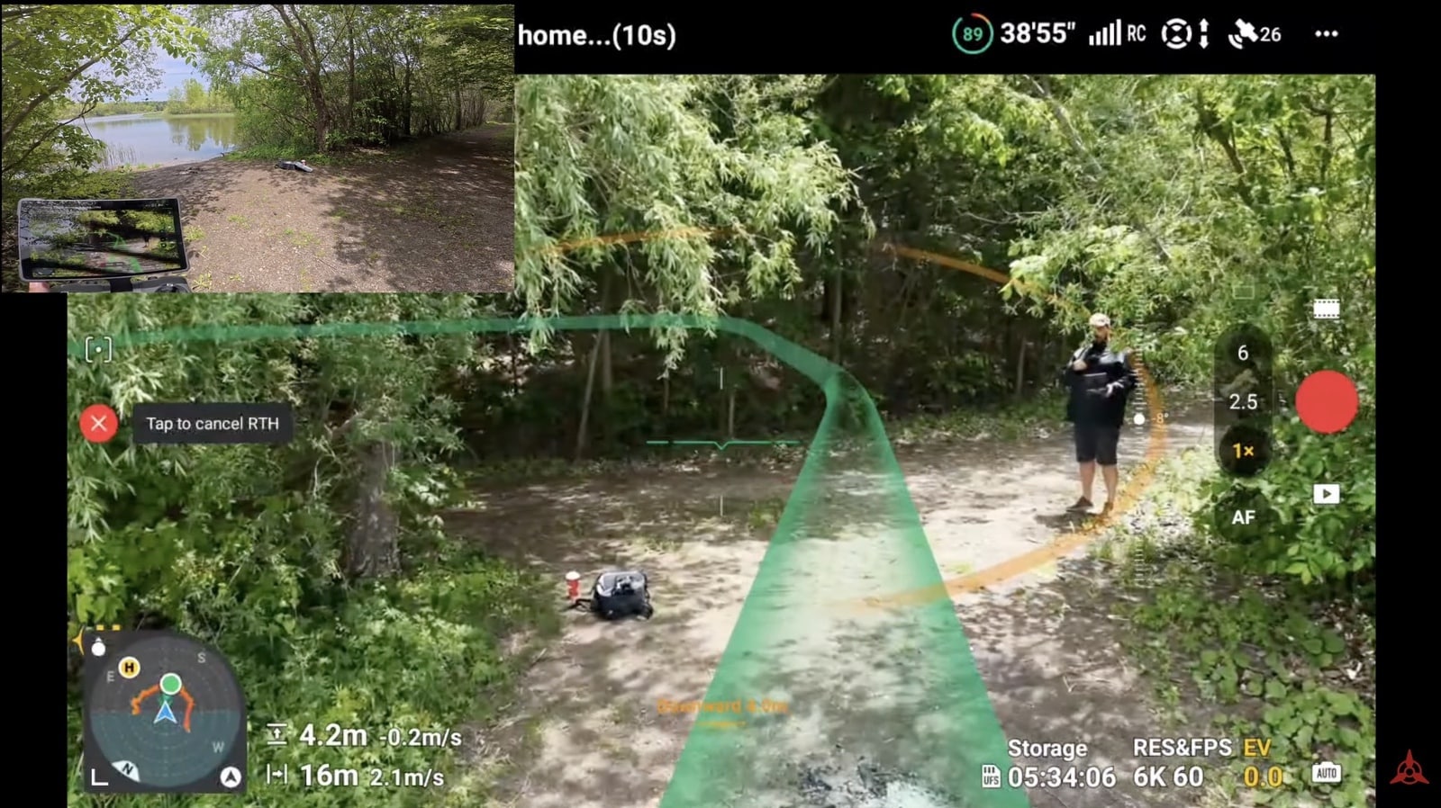 The return path curves down toward the pilot waiting on a forest trail.