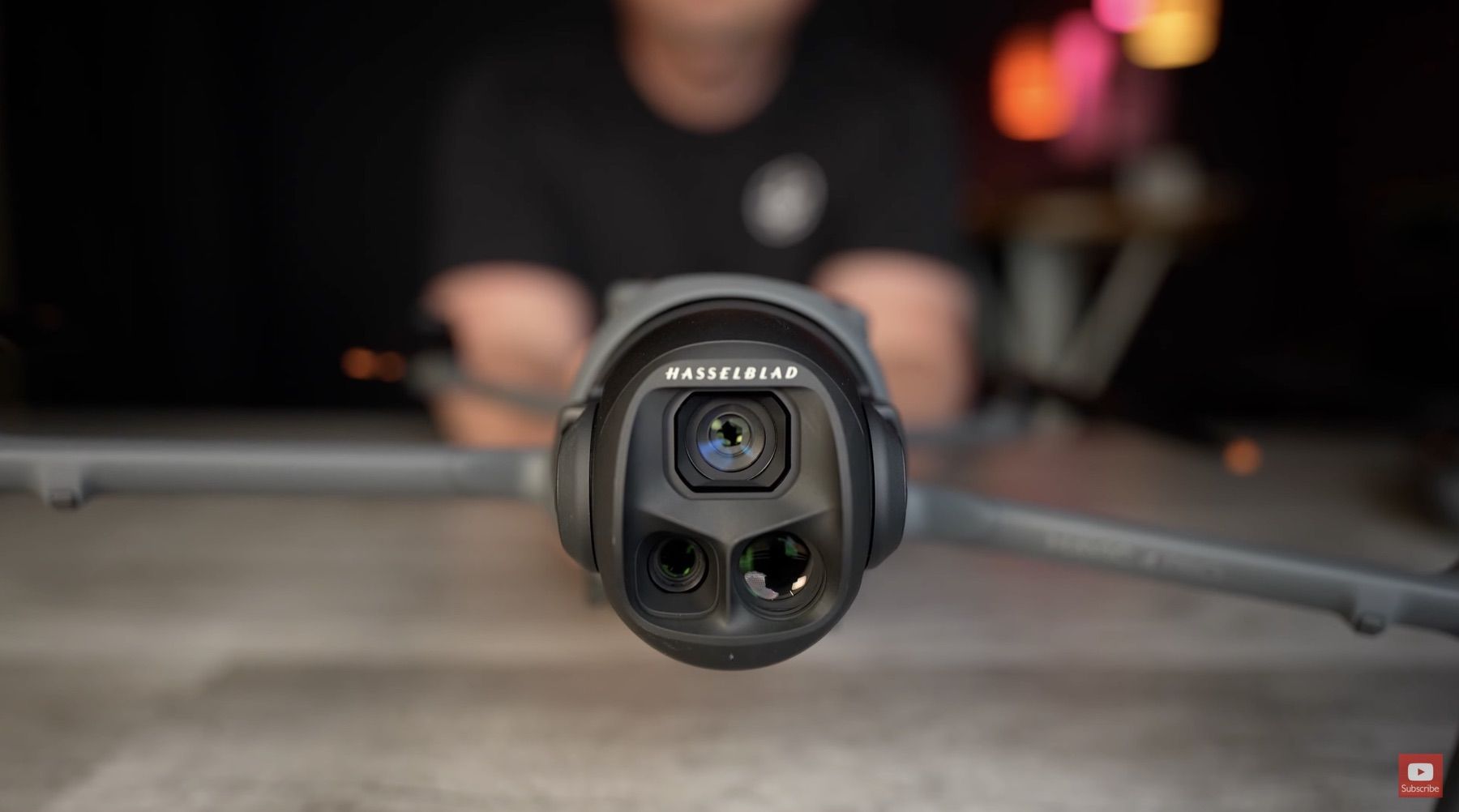 Close-up of the DJI Mavic 4 Pro Hasselblad triple-camera gimbal held in hand.