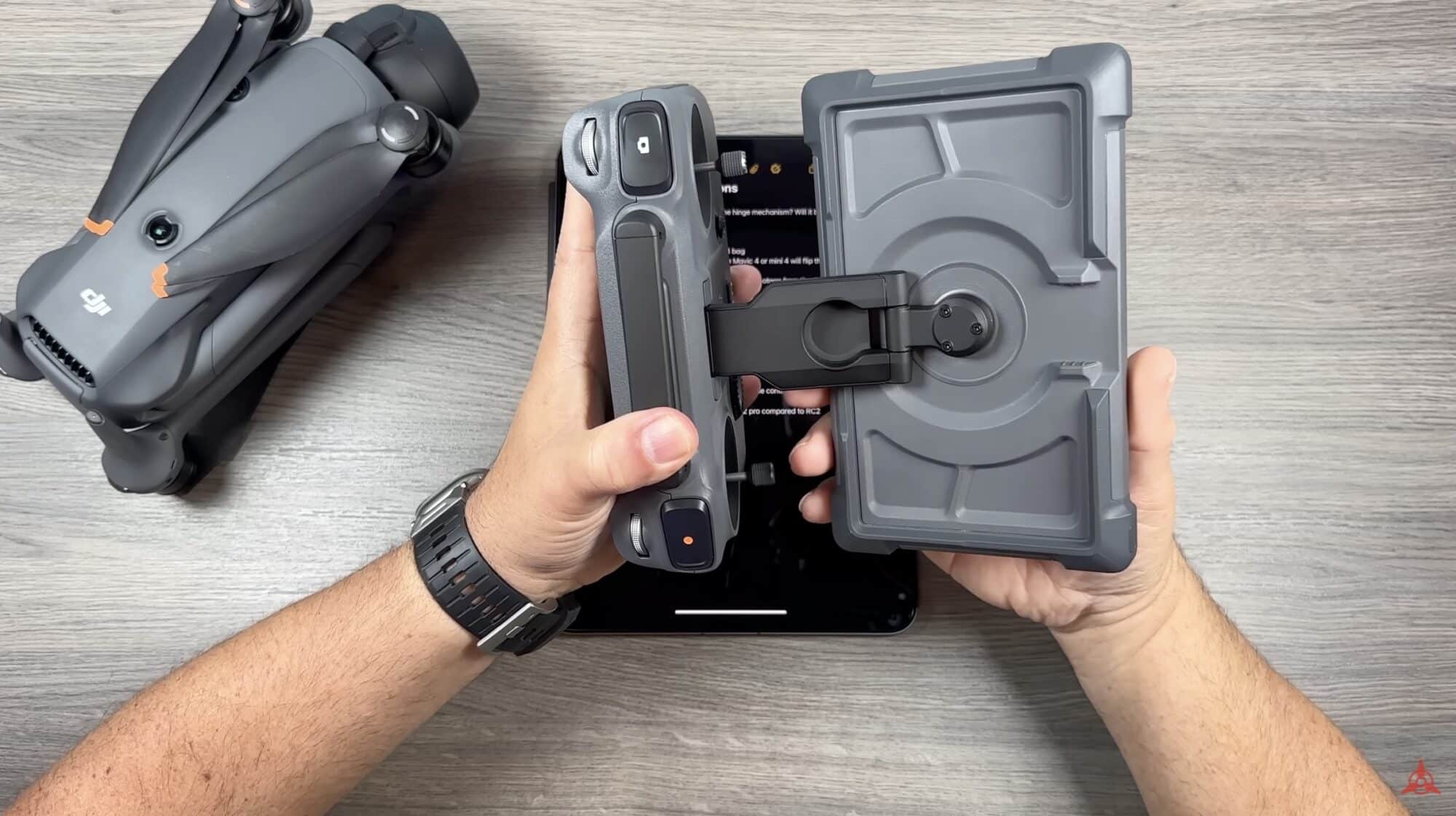 Hands fold the DJI RC Pro 2 controller beside a folded Mavic 4 Pro.