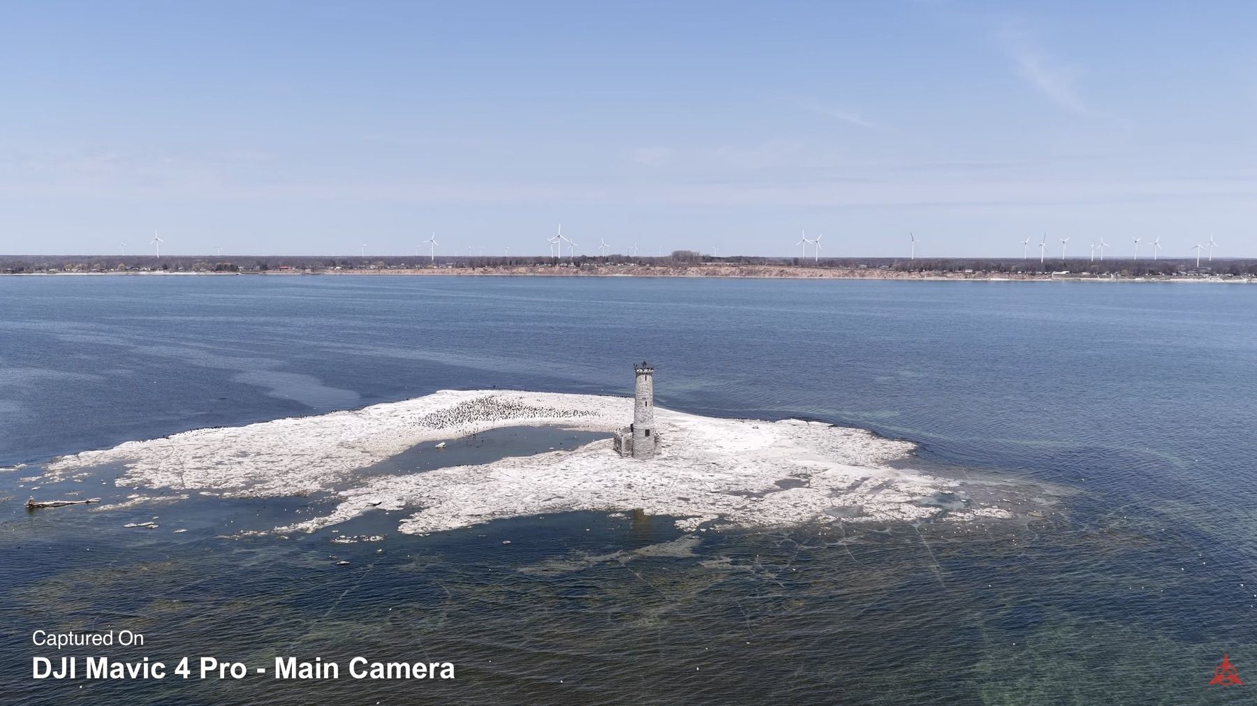A stone lighthouse on a snowy island framed by the Hasselblad main camera.