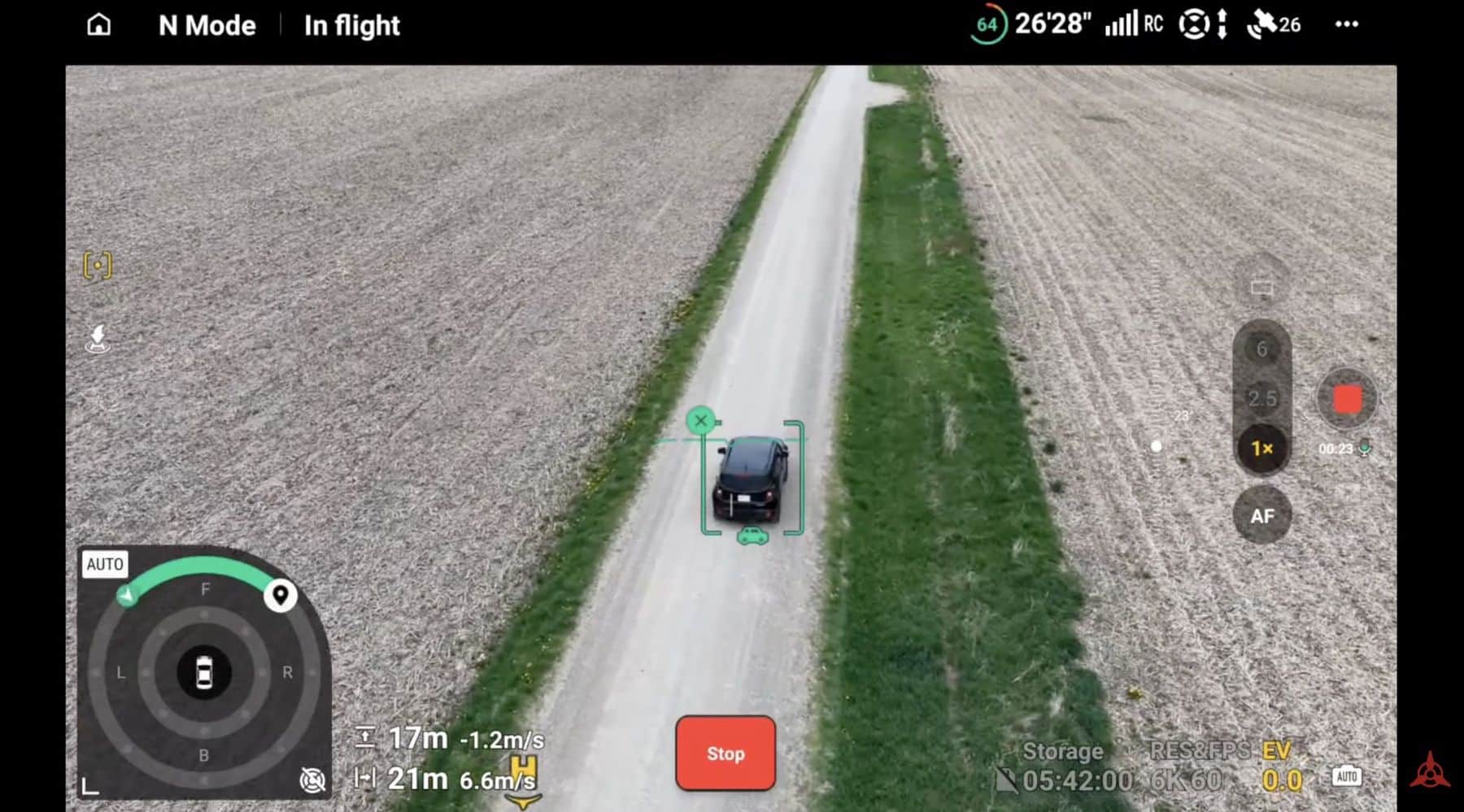 ActiveTrack locks a green box onto a dark car on a gravel farm road.