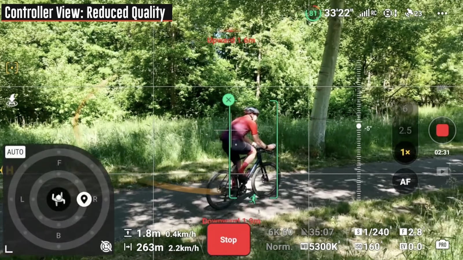 Controller view with ActiveTrack locked onto a cyclist riding a shaded woodland trail.