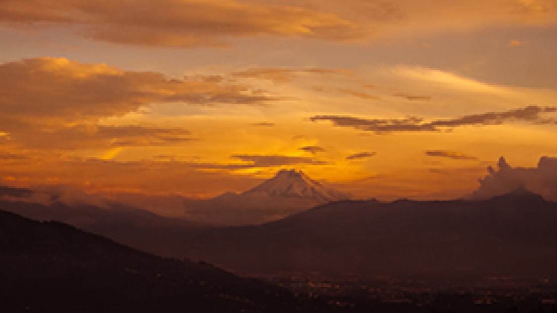 The same sunset frame degraded into visible blocks by social media compression.