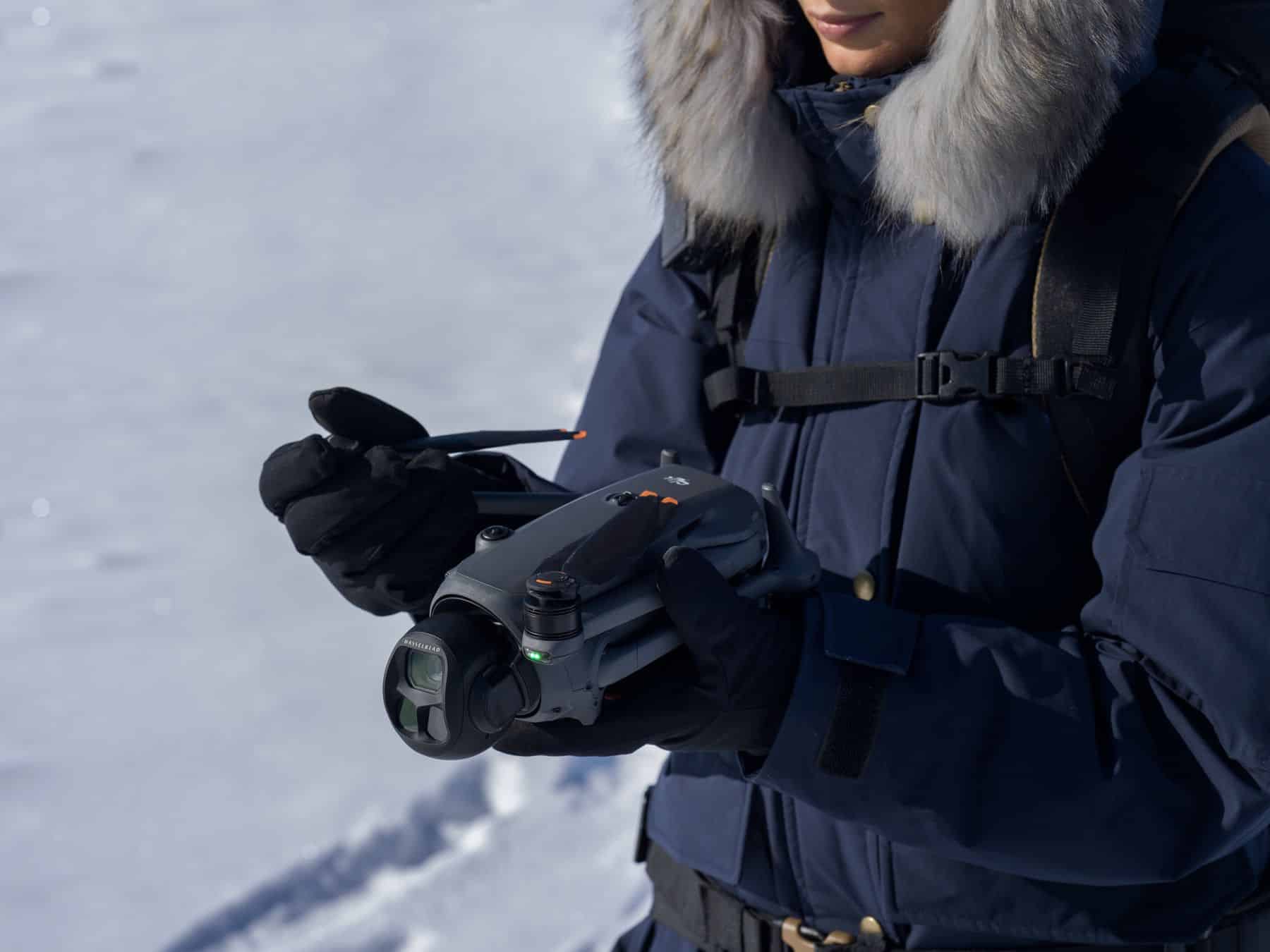 The Mavic 4 Pro powering on automatically as its arms are unfolded.