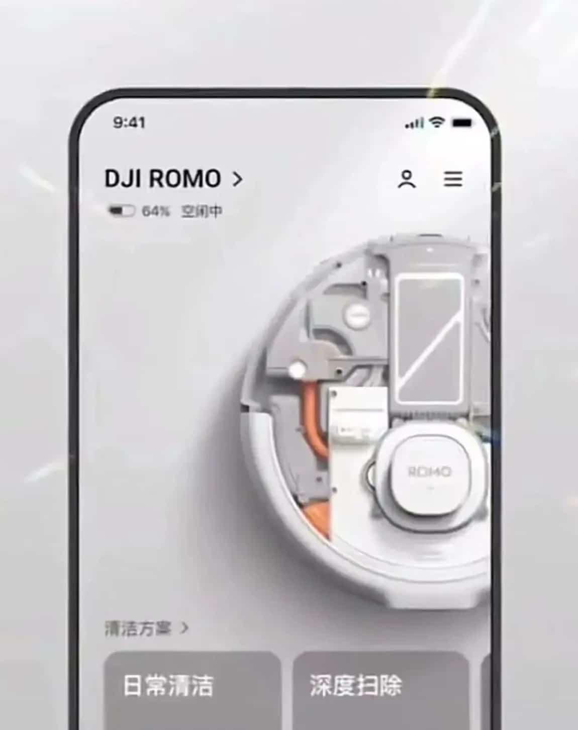 A phone runs the DJI ROMO app above the robot vacuum's exposed internal components.