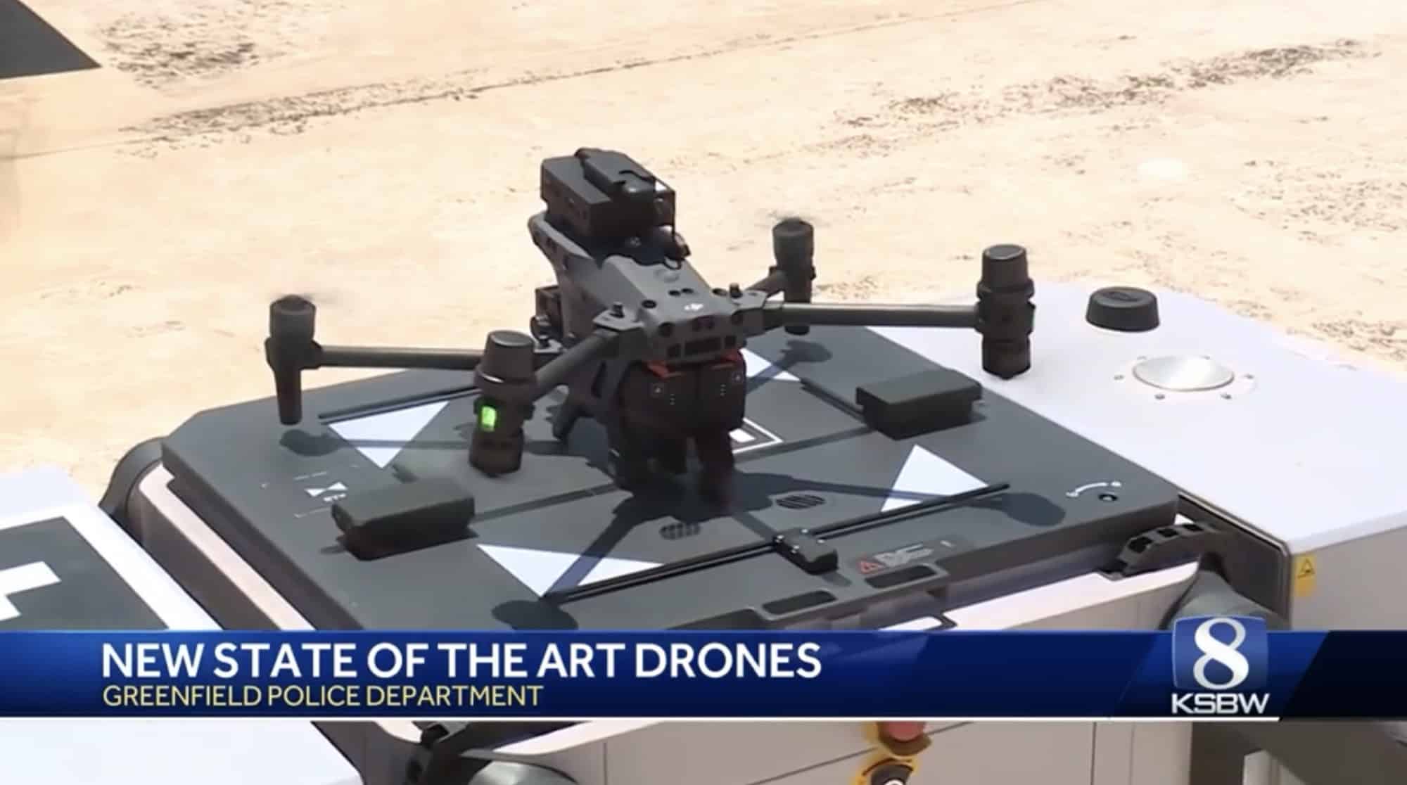 News footage of a police quadcopter resting on its automated rooftop dock.