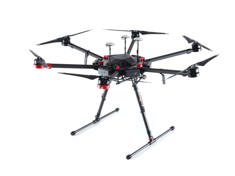Studio shot of a DJI Matrice 600 hexacopter with arms and landing gear extended.
