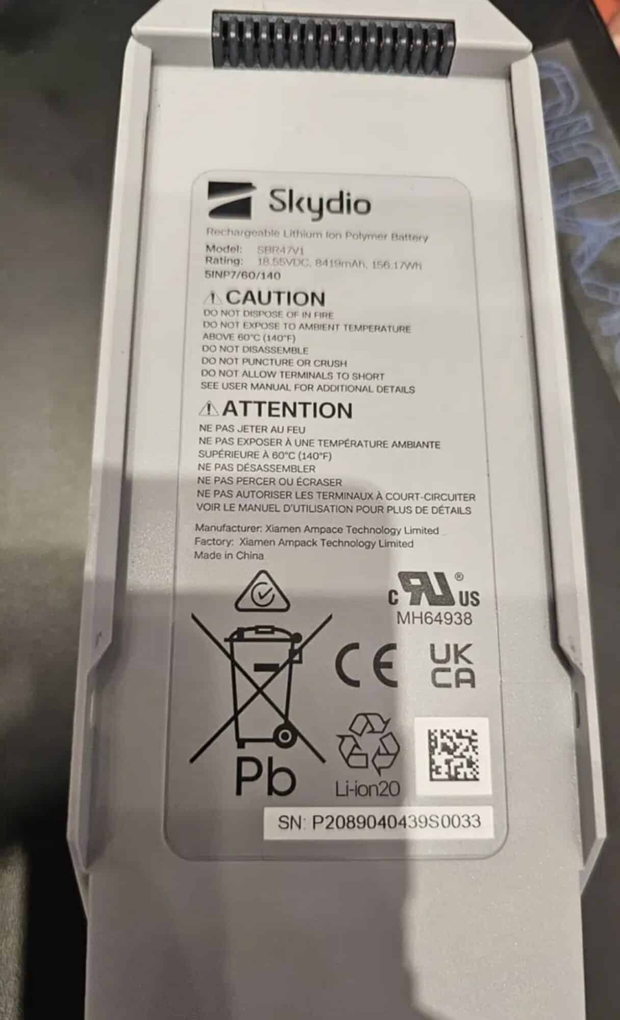 Close-up of a Skydio battery label showing certification marks and serial number.